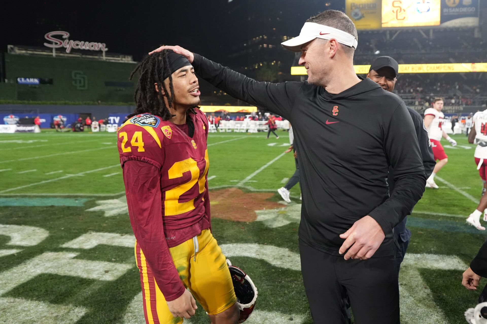 Southern California Trojans head coach Lincoln Riley (right) celebrates with wide receiver Makai Lemon (24) after the Holiday Bowl against the Louisville Cardinals at Petco Park.