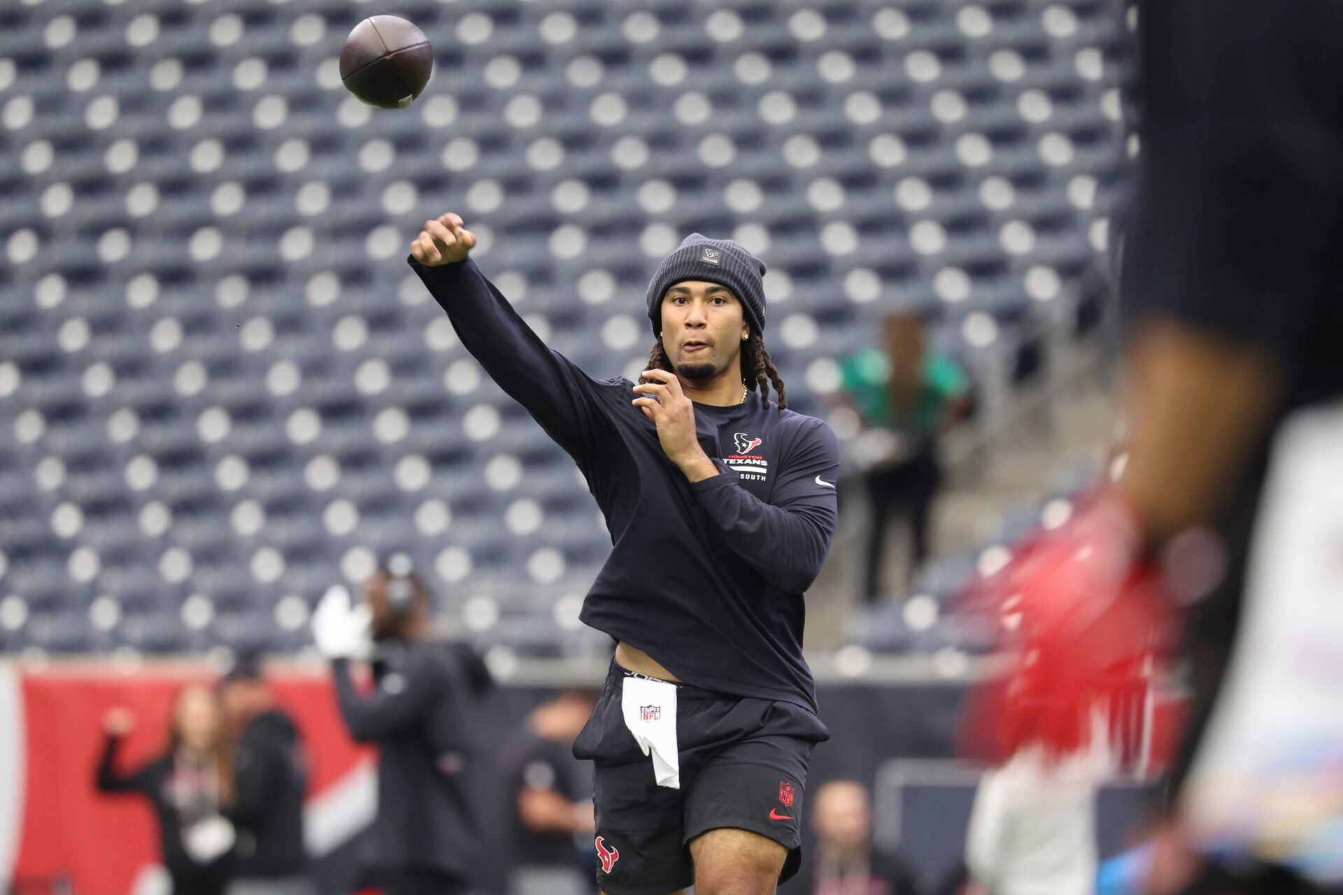 Houston Texans quarterback CJ. Stroud (7) warms up before the game against the Tennessee Titans at NRG Stadium.