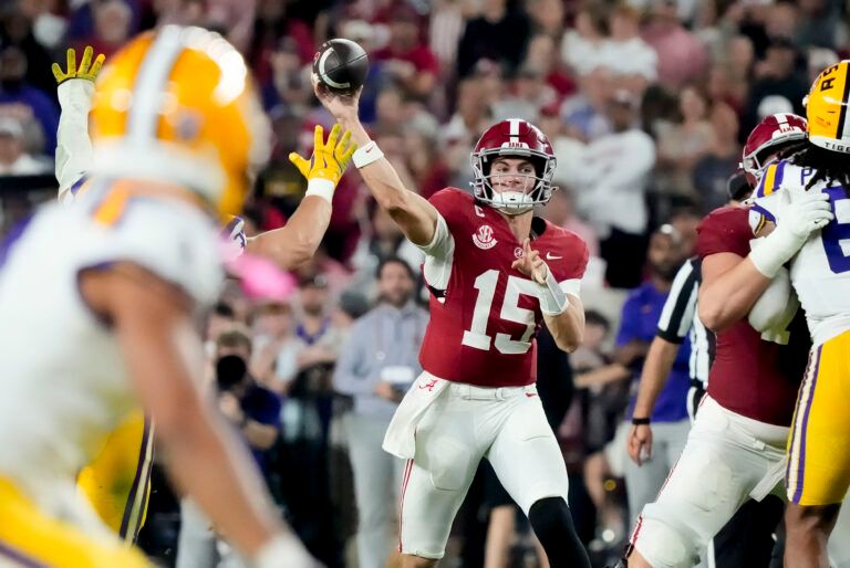 Alabama quarterback Ty Simpson (15) throws a pass that was deflected and was eventually caught by Alabama offensive lineman Wilkin Formby (75) at Saban Field at Bryant-Denny Stadium. Alabama defeated LSU 20-9.