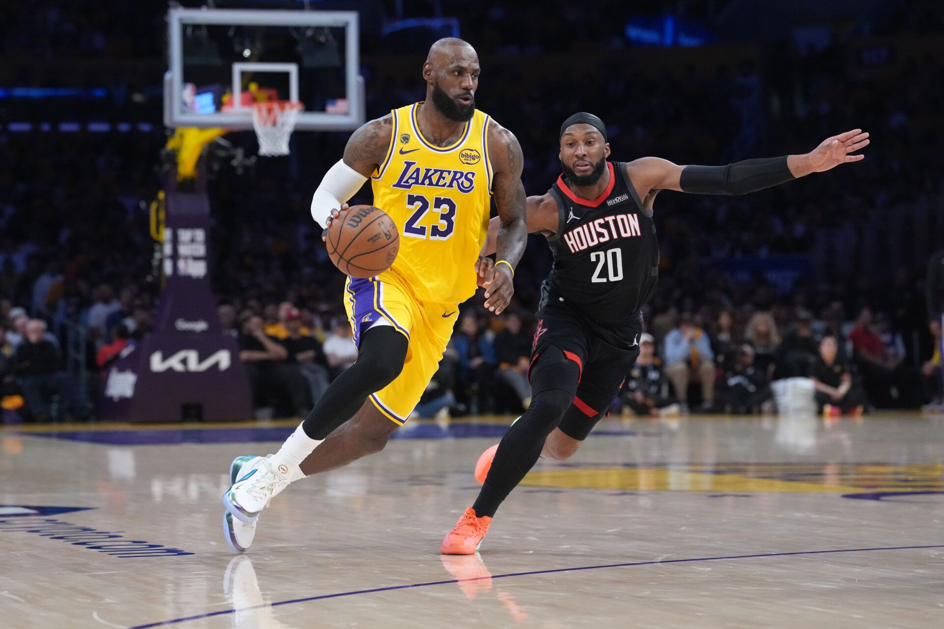 Los Angeles Lakers forward LeBron James (23) drives to the basket agianst Houston Rockets guard Josh Okogie (20) in the first half during game one of the first round of the 2026 NBA Playoffs at Crypto.com Arena.