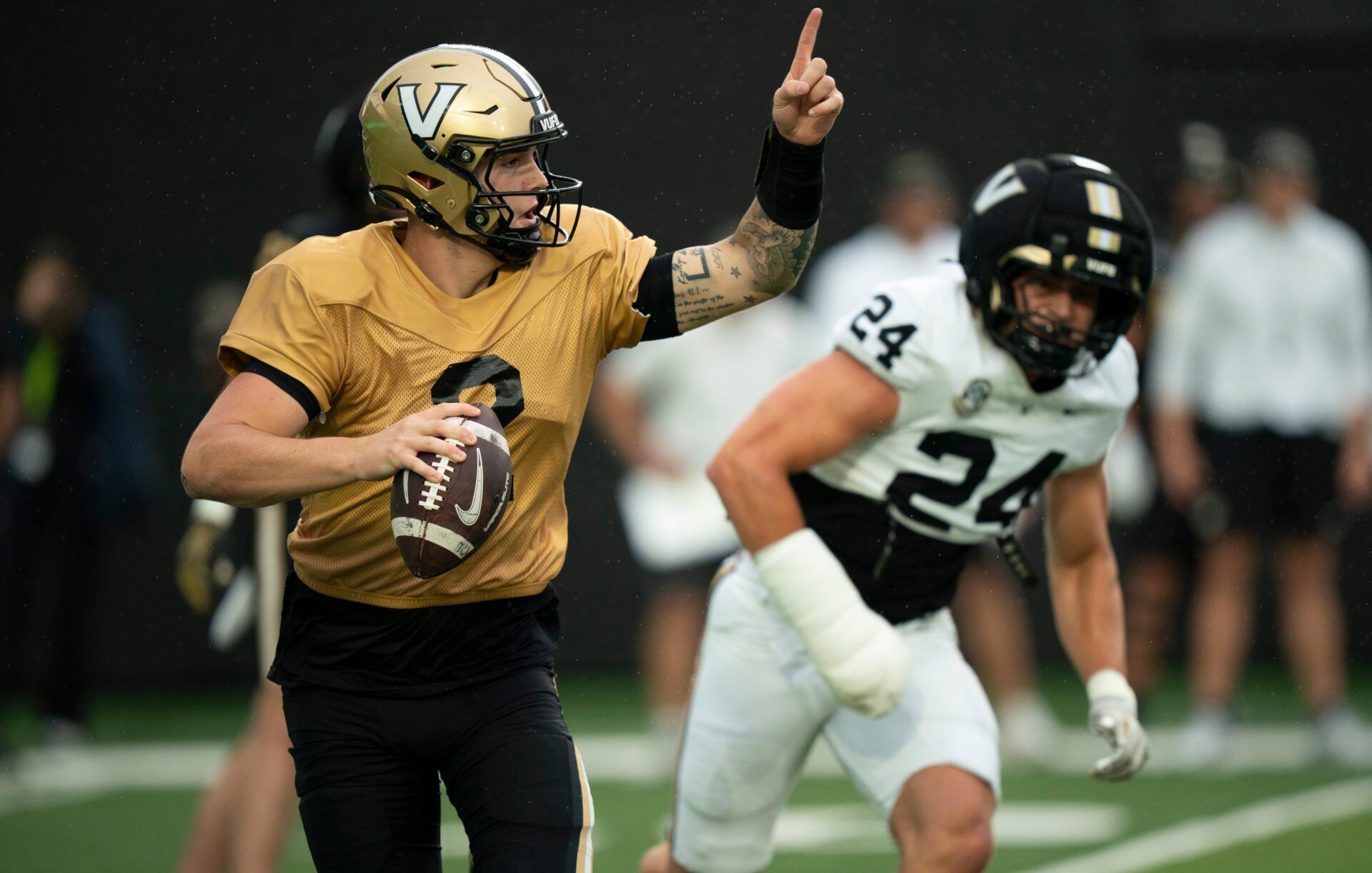 Vanderbilt quarterback Jared Curtis (2) directs his receivers while pressured by Vanderbilt linebacker Nick Rinaldi (24) during Vanderbilt Football's Black and Gold Spring Game in FirstBank Stadium at Vanderbilt University Saturday, April 18, 2026.