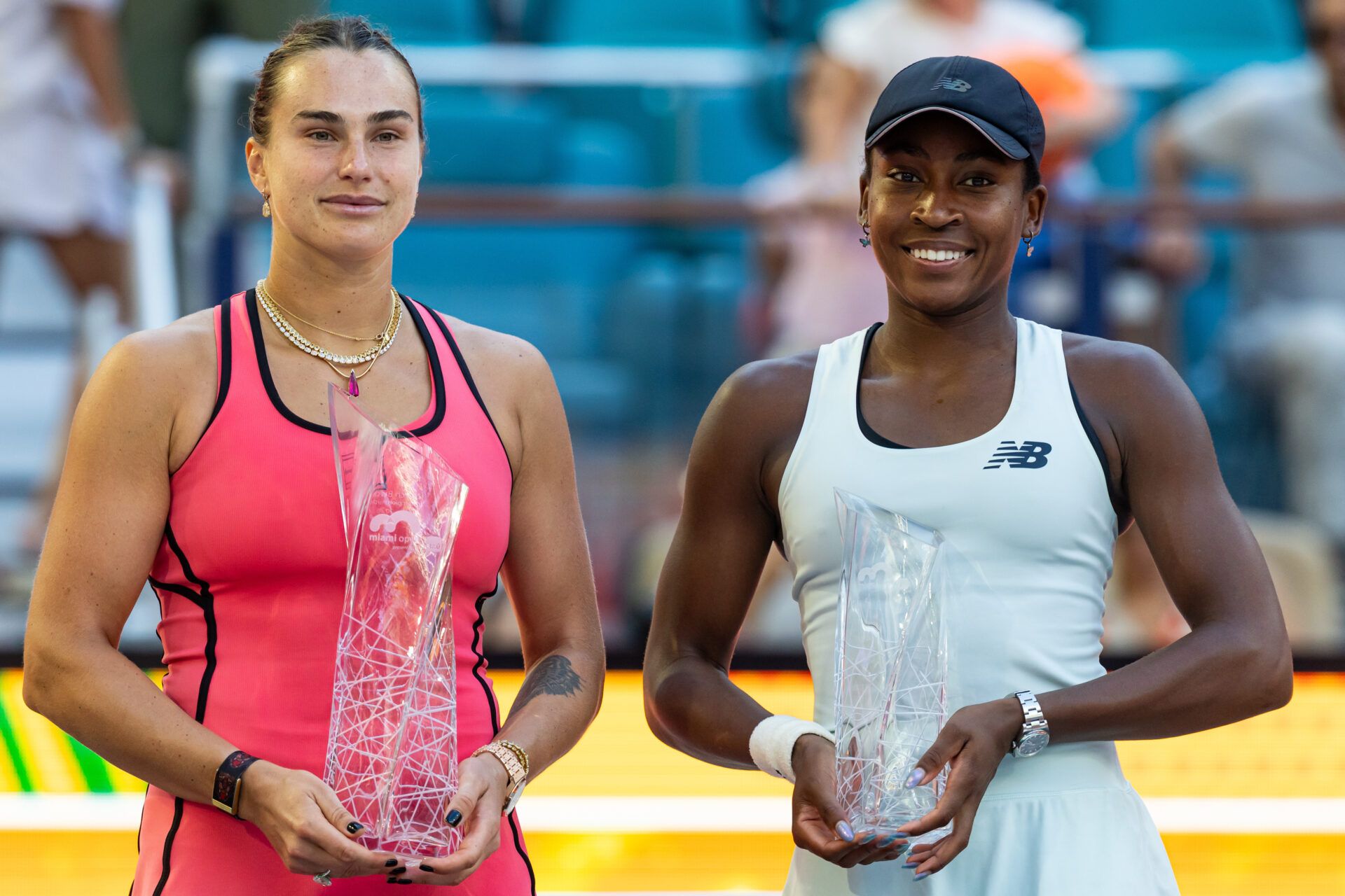 Aryna Sabalenka of Belarus and Coco Gauff of the United States pose with their trophies after the final of the womenÕs singles at the Hard Rock Stadium.