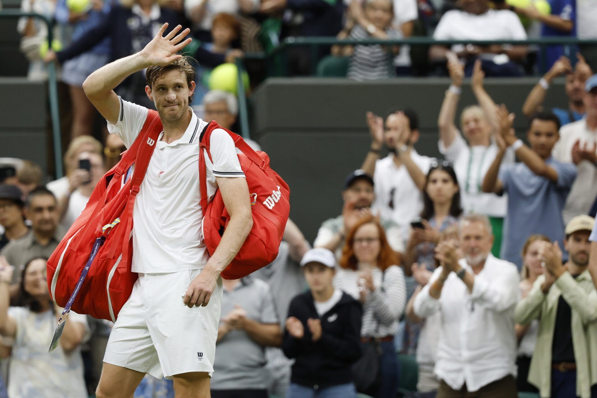 Nicolas Jarry (CHI) waves to fans while leaving the court after his match against Cameron Norrie (GBR)(not pictured) on day seven of The Championships Wimbledon 2025 at All England Lawn Tennis and Croquet Club.