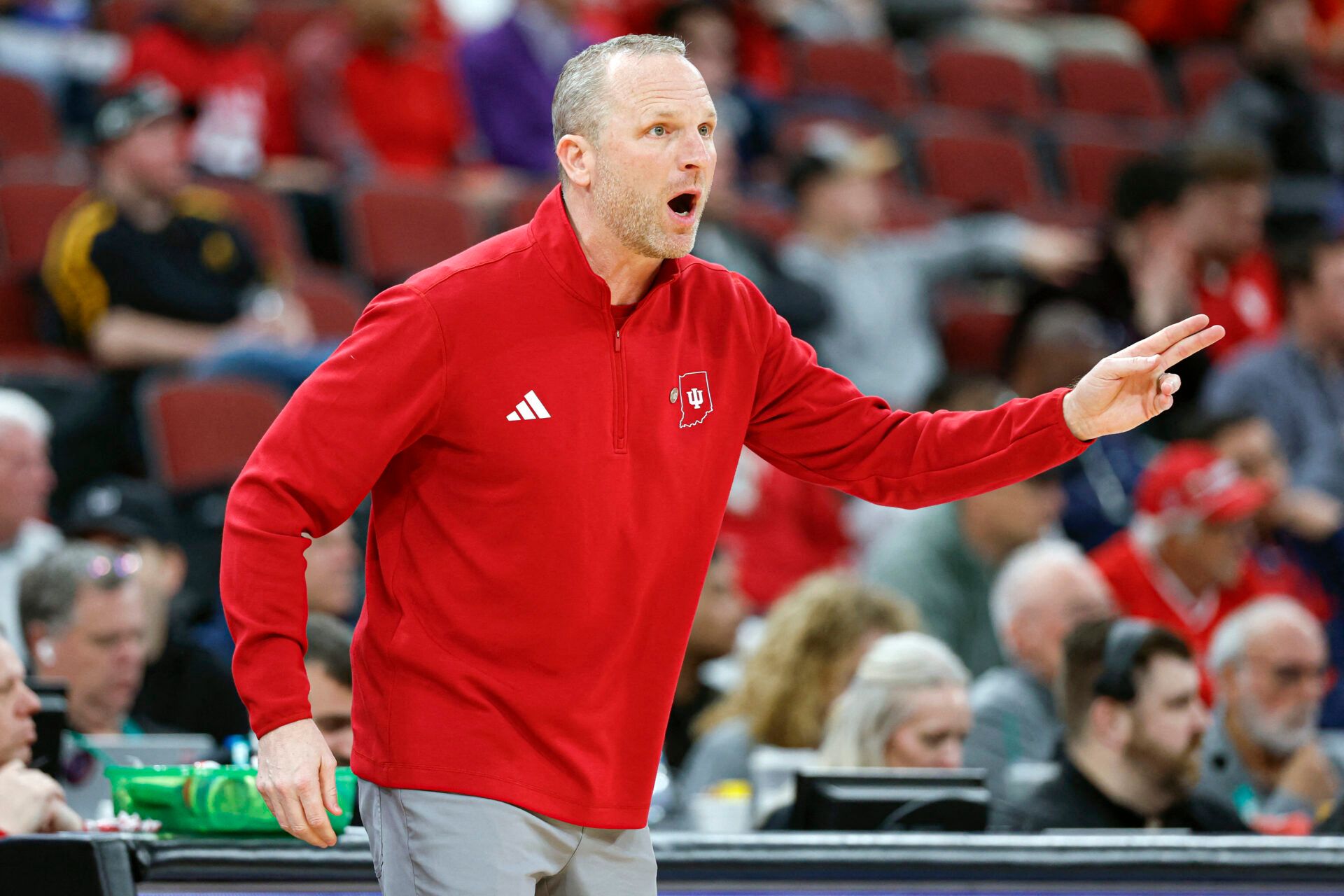 Indiana Hoosiers head coach Darian Devries directs his team against the Northwestern Wildcats during the first half at United Center.
