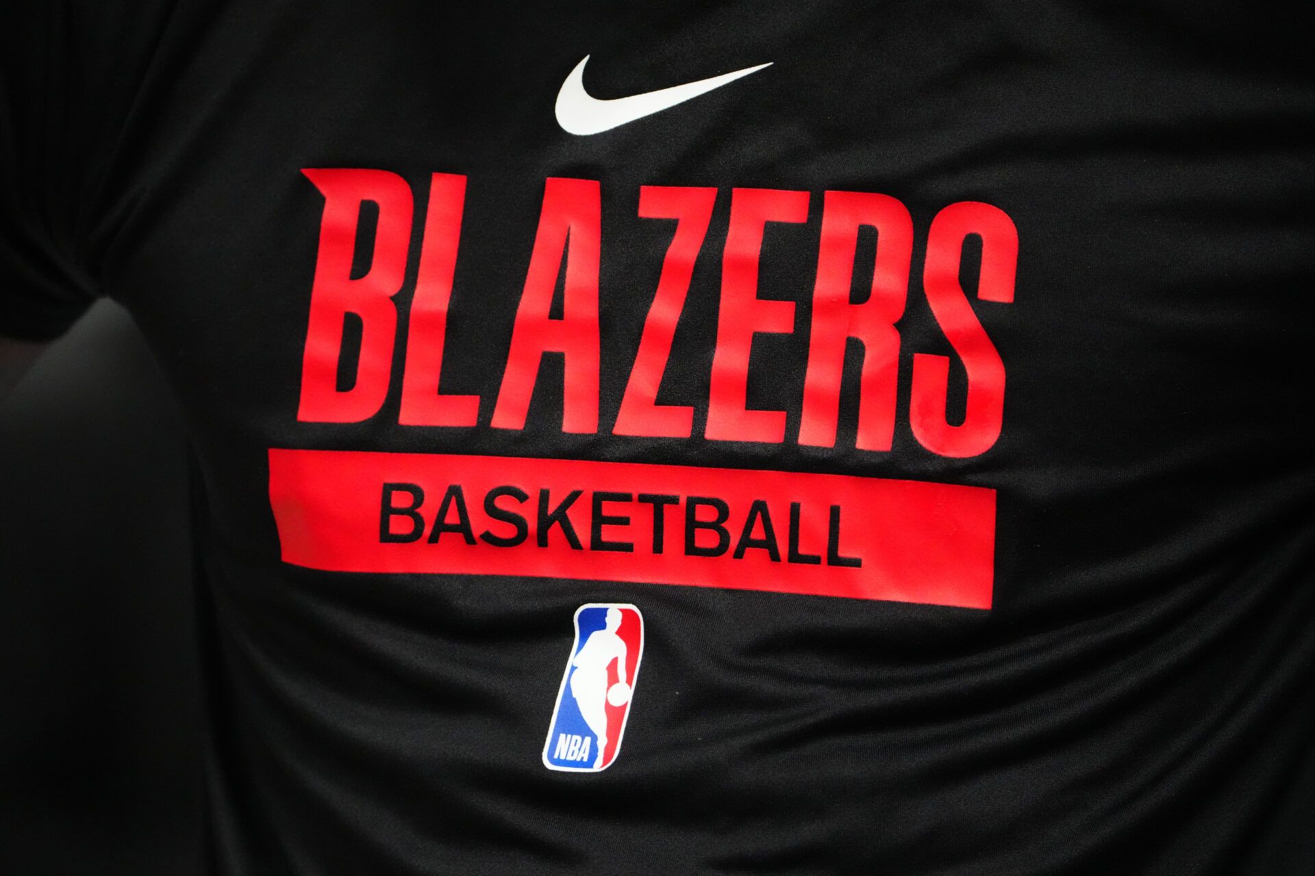 Detailed view of a Portland Trail Blazers logo warmup jersey before the game against the Denver Nuggets at Ball Arena.