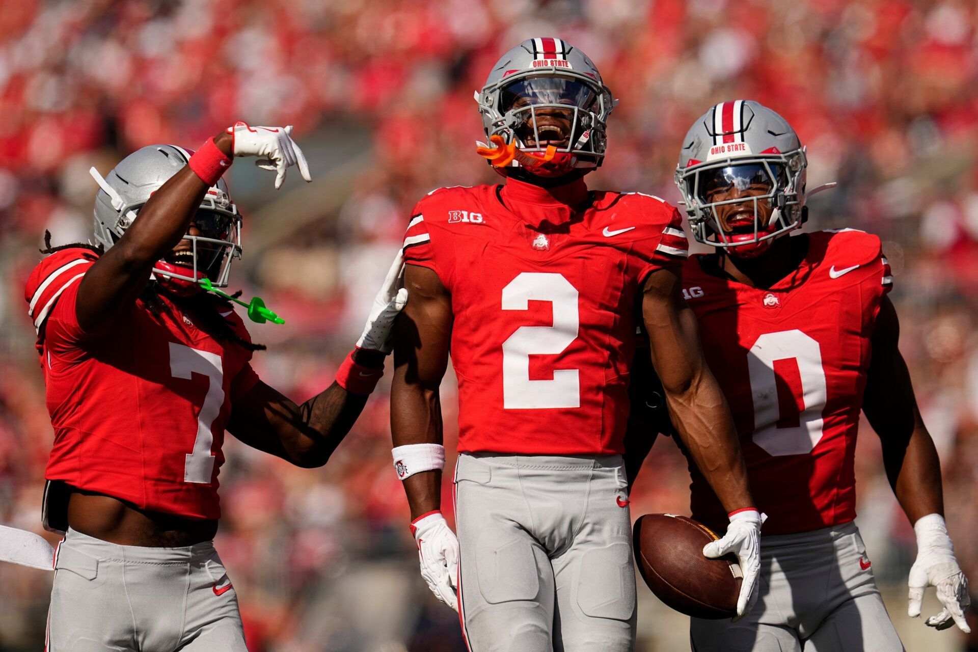 Ohio State Buckeyes safety Caleb Downs (2) celebrates an interception with cornerback Jermaine Mathews Jr. (7) abnd linebacker Sonny Styles (0) during the first half of the NCAA football game against the Grambling State Tigers at Ohio Stadium on Sept. 6, 2025.