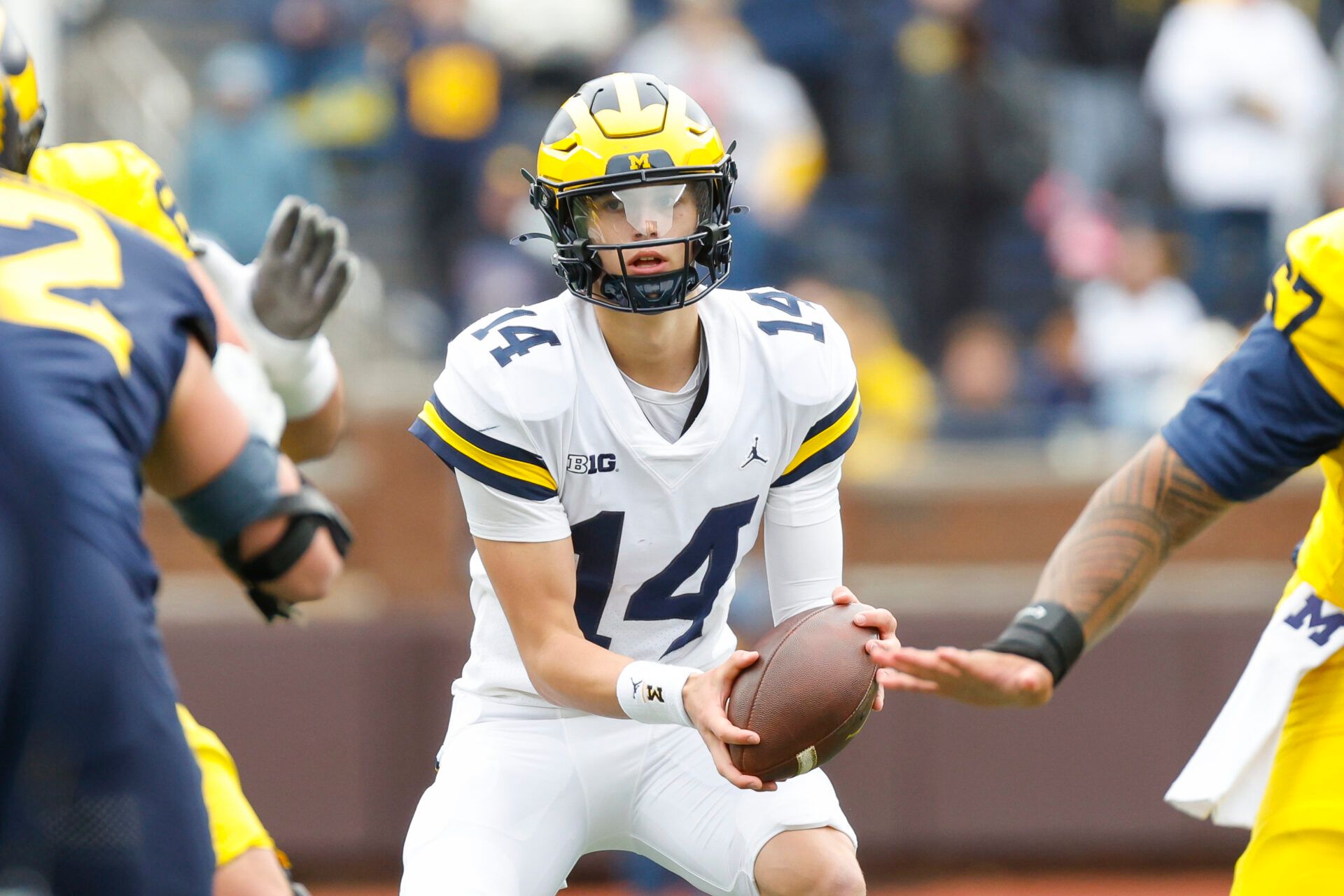 Michigan Wolverines quarterback Tommy Carr (14) looks on during the first half at Michigan Stadium.