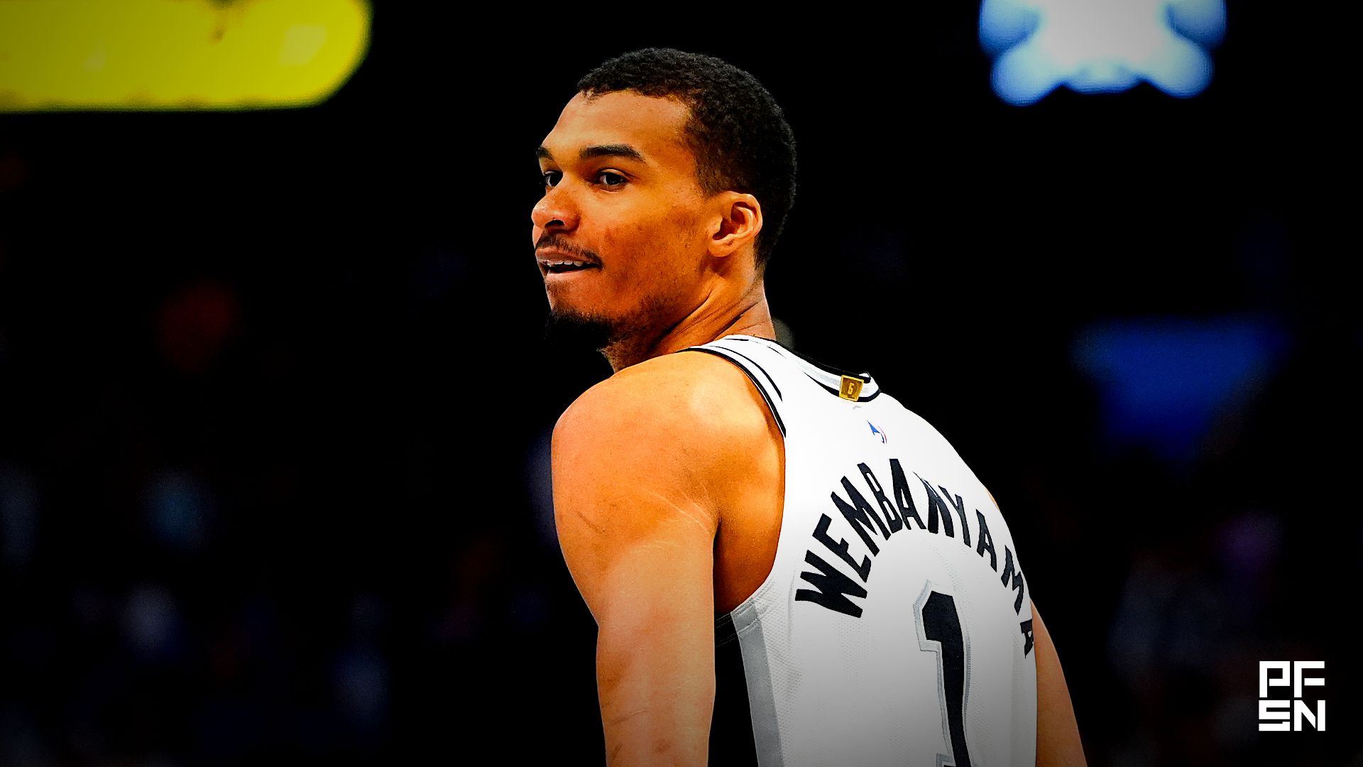 San Antonio Spurs forward Victor Wembanyama (1) reacts back to the Denver Nuggets bench in the first quarter at Ball Arena.