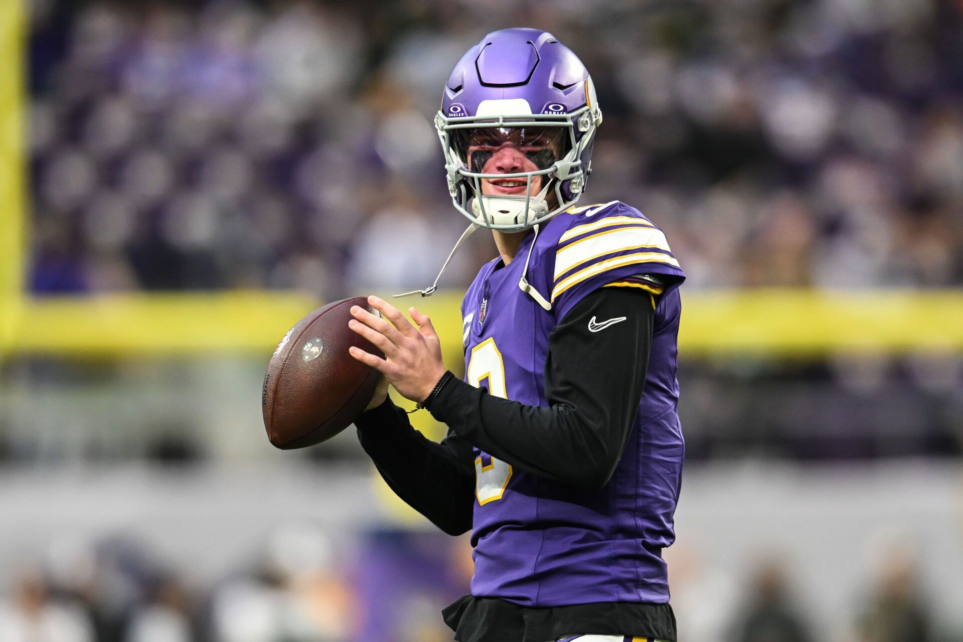 Minnesota Vikings quarterback J.J. McCarthy (9) warms up before the game against the Green Bay Packers at U.S. Bank Stadium.