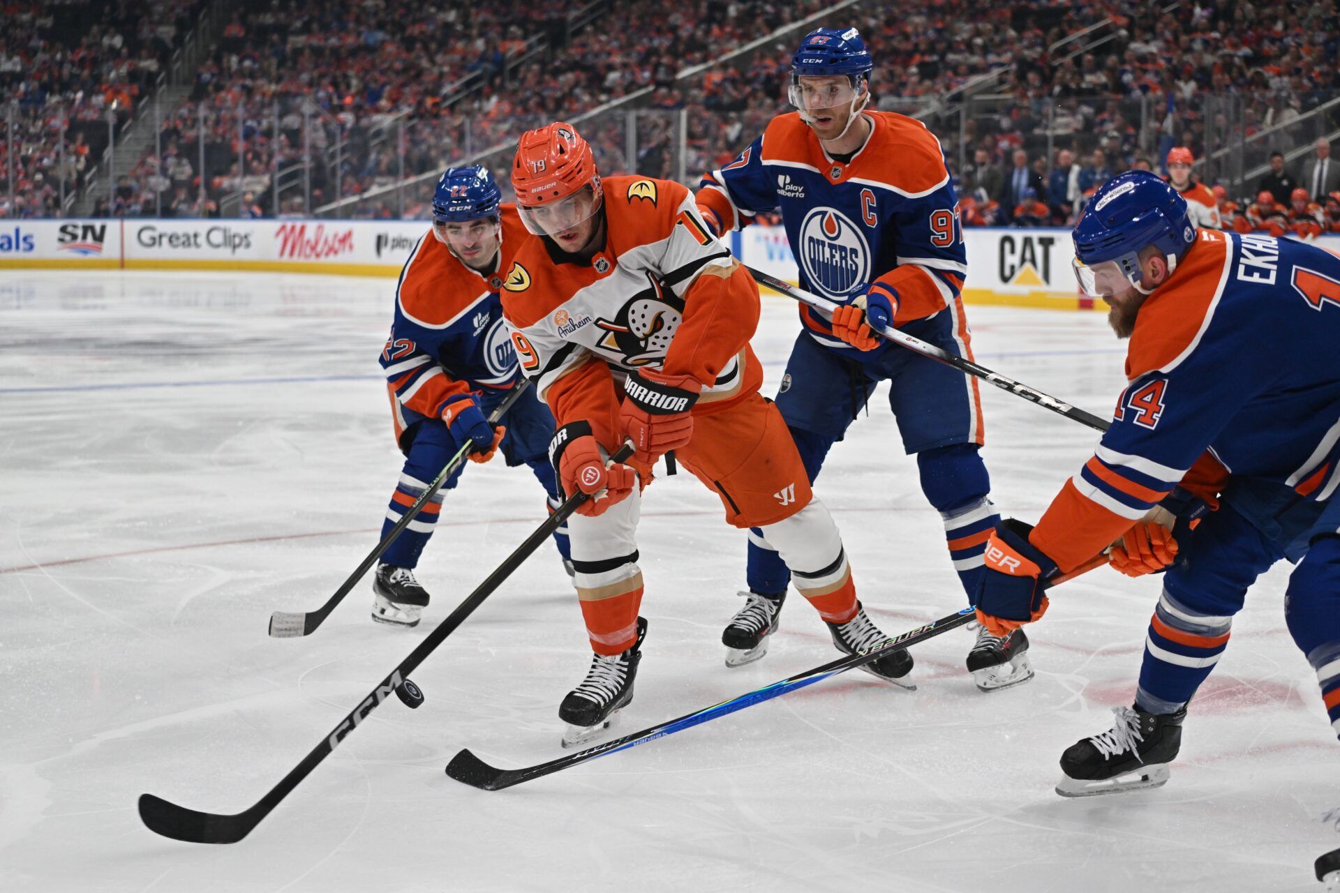Edmonton Oilers center Matt Savoie (22) with center Connor McDavid (97) attempt to stop Anaheim Ducks right winger Troy Terry (19) in game one of the first round of the 2026 Stanley Cup Playoffs during the second period at Rogers Place.