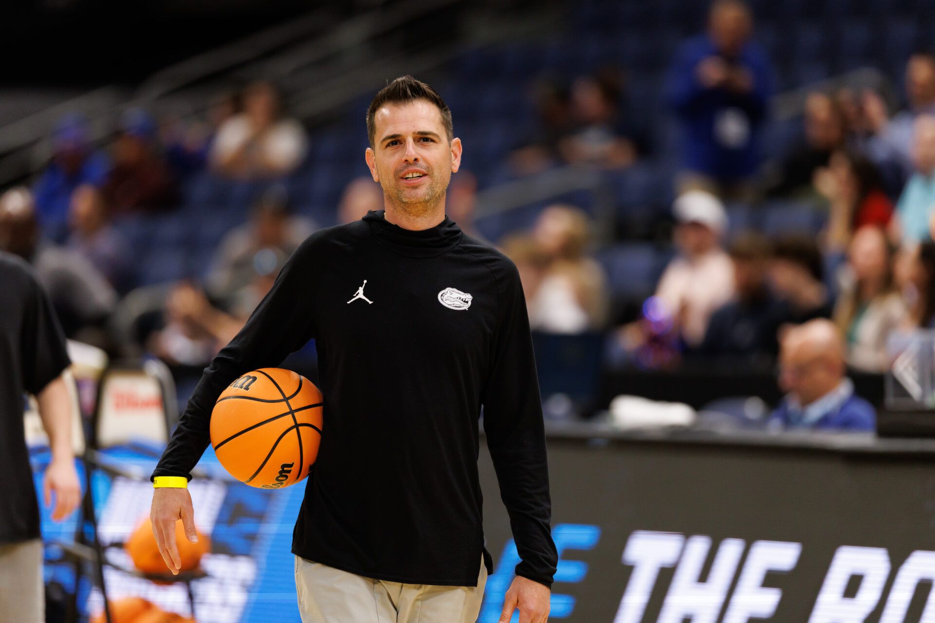 Florida Gators head coach Todd Golden smiles during a practice session ahead of the first round of the men's 2026 NCAA Tournament at Benchmark International Arena.