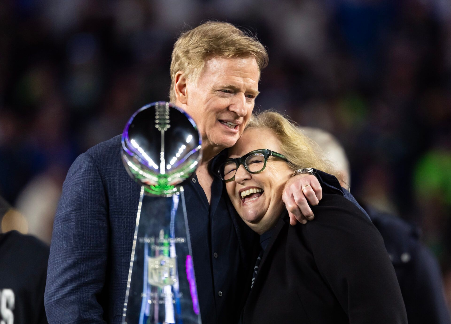Seattle Seahawks chairman Jody Allen (right) celebrates with NFL commissioner Roger Goodell and the the Vince Lombardi trophy on the podium after defeating the New England Patriots in Super Bowl LX at Levi's Stadium.