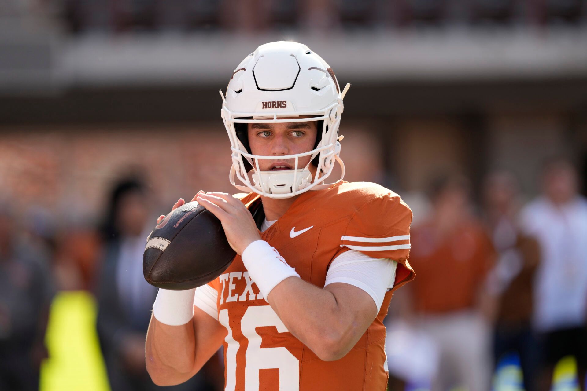 Texas Longhorns quarterback Arch Manning (16) warms up before a game against the Arkansas Razorbacks at Darrell K Royal-Texas Memorial Stadium.