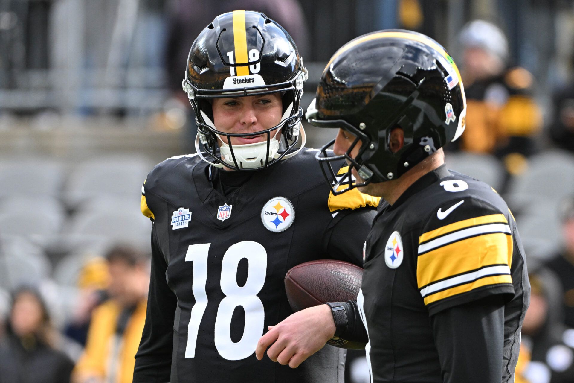 Pittsburgh Steelers quarterback Will Howard (18) talks with quarterback Aaron Rodgers (8) before the game against the Cincinnati Bengals at Acrisure Stadium.