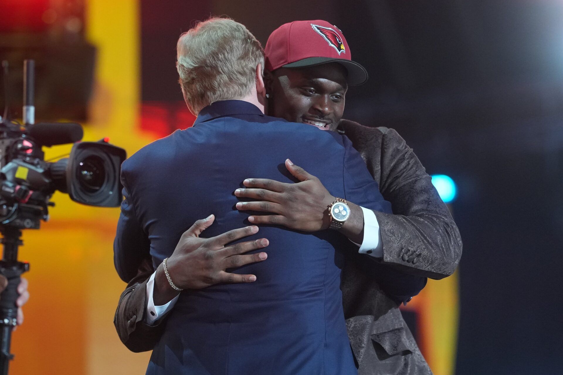 Notre Dame Fighting Irish running back Jeremiyah Love embraces NFL commissioner Roger Goodell after he is selected by the Arizona Cardinals as the number three pick during the 2026 NFL Draft at Acrisure Stadium.