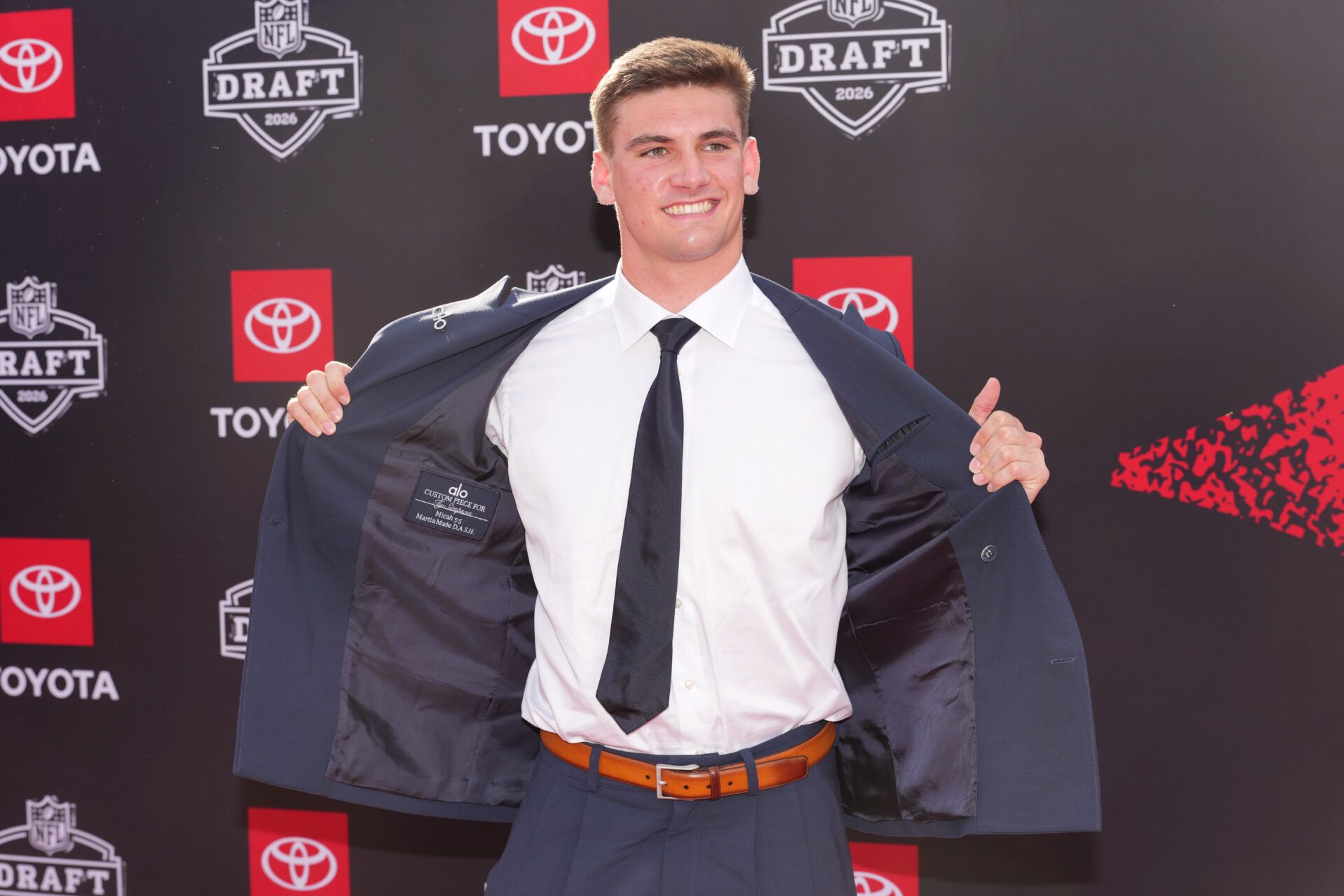 Alabama Crimson Tide quarterback Ty Simpson poses on the red carpet before the 2026 NFL Draft at Point State Park.