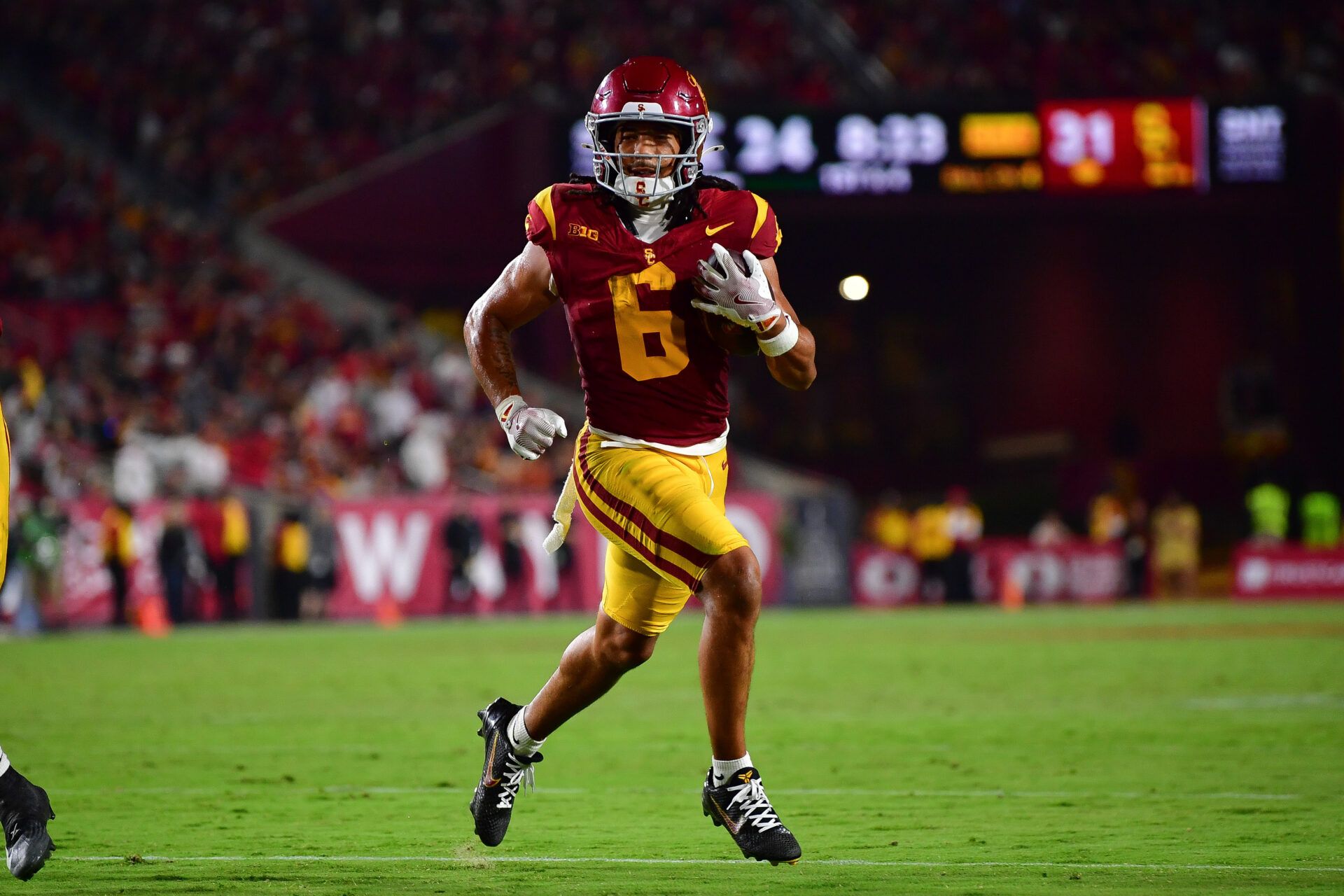 Southern California Trojans wide receiver Makai Lemon (6) runs for a touchdown against the Michigan State Spartans during the second half at the Los Angeles Memorial Coliseum.