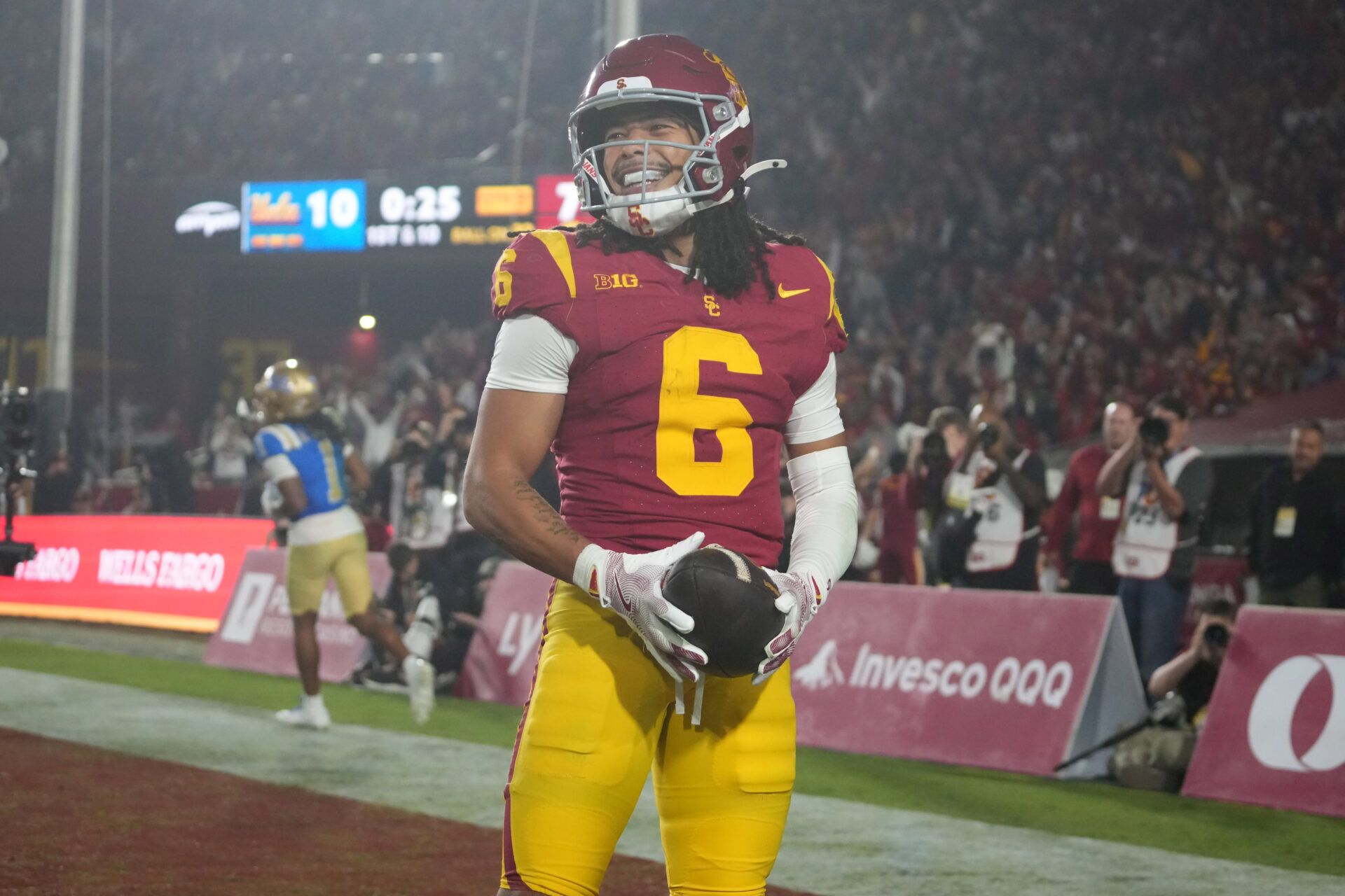 Southern California Trojans wide receiver Makai Lemon (6) celebrates after catching a 32-yard touchdown pass against the UCLA Bruins in the second half at United Airlines Field at Los Angeles Memorial Coliseum.