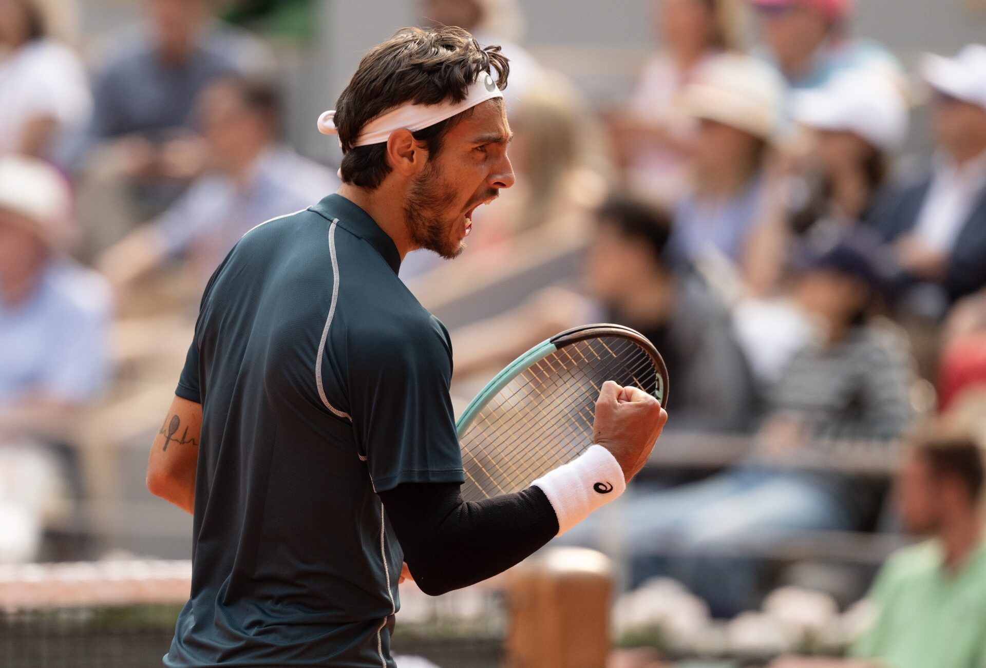 Lorenzo Musetti of Italy reacts to a point during his match  against Frances Tiafoe of the United States on day 10 at Roland Garros Stadium.