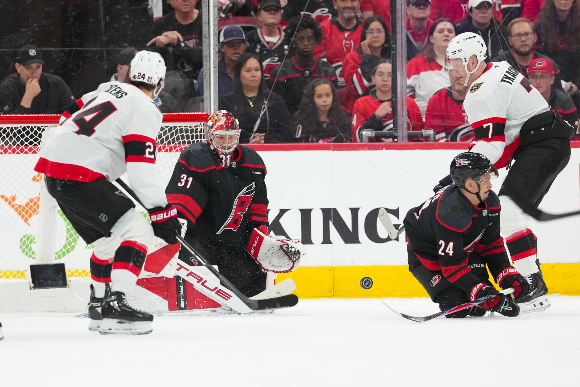 Carolina Hurricanes center Seth Jarvis (24) with goaltender Frederik Andersen (31) go to block the shot by Ottawa Senators left wing Brady Tkachuk (7) during the third period in game one of the first round of the 2026 Stanley Cup Playoffs at Lenovo Center.