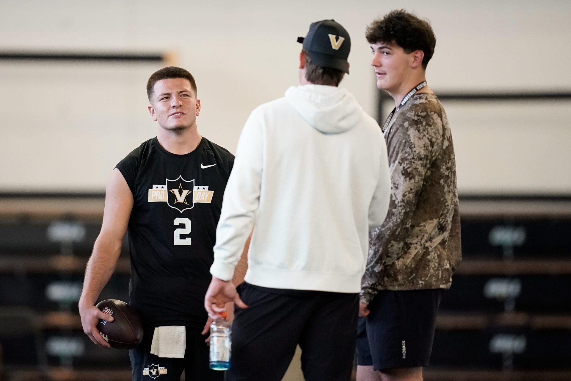 Vanderbilt quarterback Diego Pavia, left, chats with freshman quarterback Jared Curtis, right, during football pro day at Vanderbilt University in Nashville, Tenn., Friday, March 20, 2026.