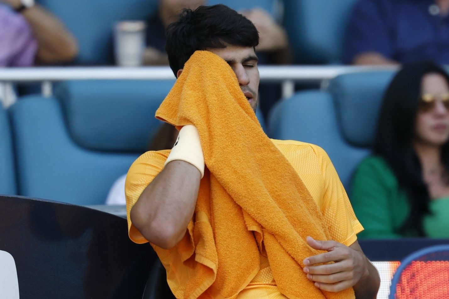 Carlos Alcaraz (ESP) wipes his face in his player's chair during a changeover against Sebastian Korda (USA) (not pictured) on day six of the 2026 Miami Open at Hard Rock Stadium.