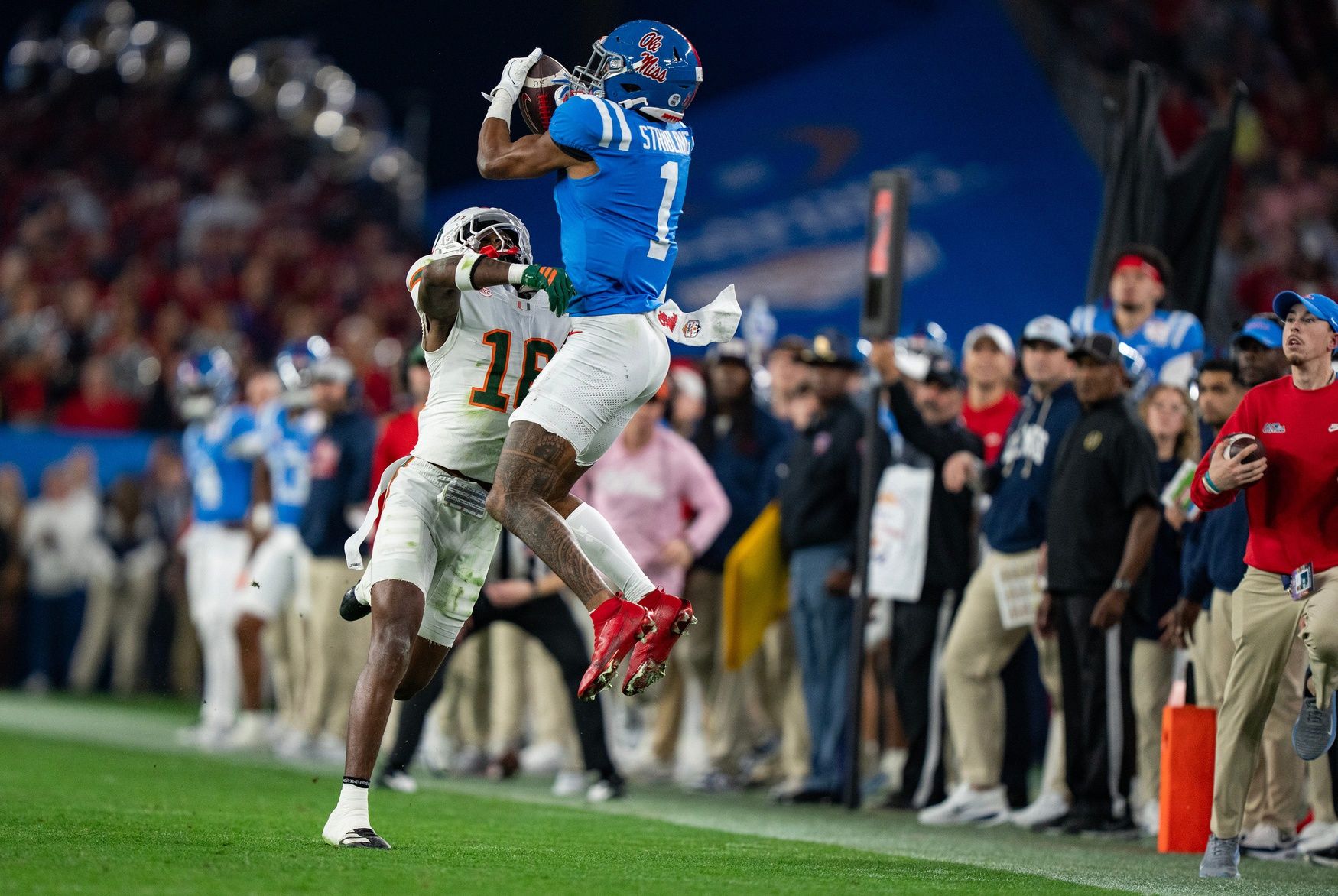 Ole Miss wide receiver De'Zhaun Stribling (1) catches the ball before being tackled by Miami Hurricanes defensive back Ja'boree Antoine (16) and dropping it during the CFP Fiesta Bowl at the State Farm Stadium, in Glendale, Ariz., on Thursday, Jan. 8, 2026.