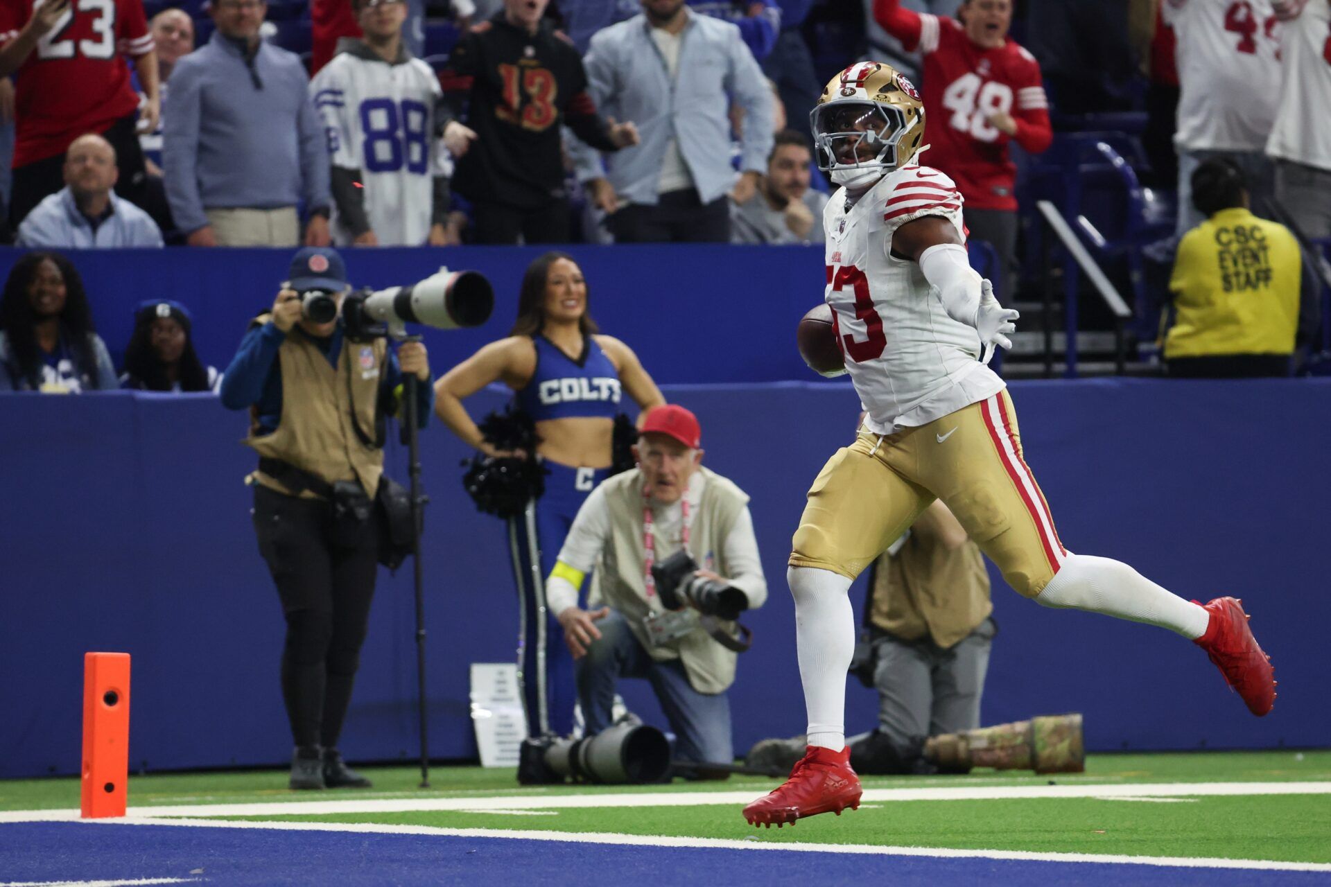 San Francisco 49ers linebacker Dee Winters (53) carries the ball after an interception for a touchdown against the Indianapolis Colts in the fourth quarter of the game at Lucas Oil Stadium.