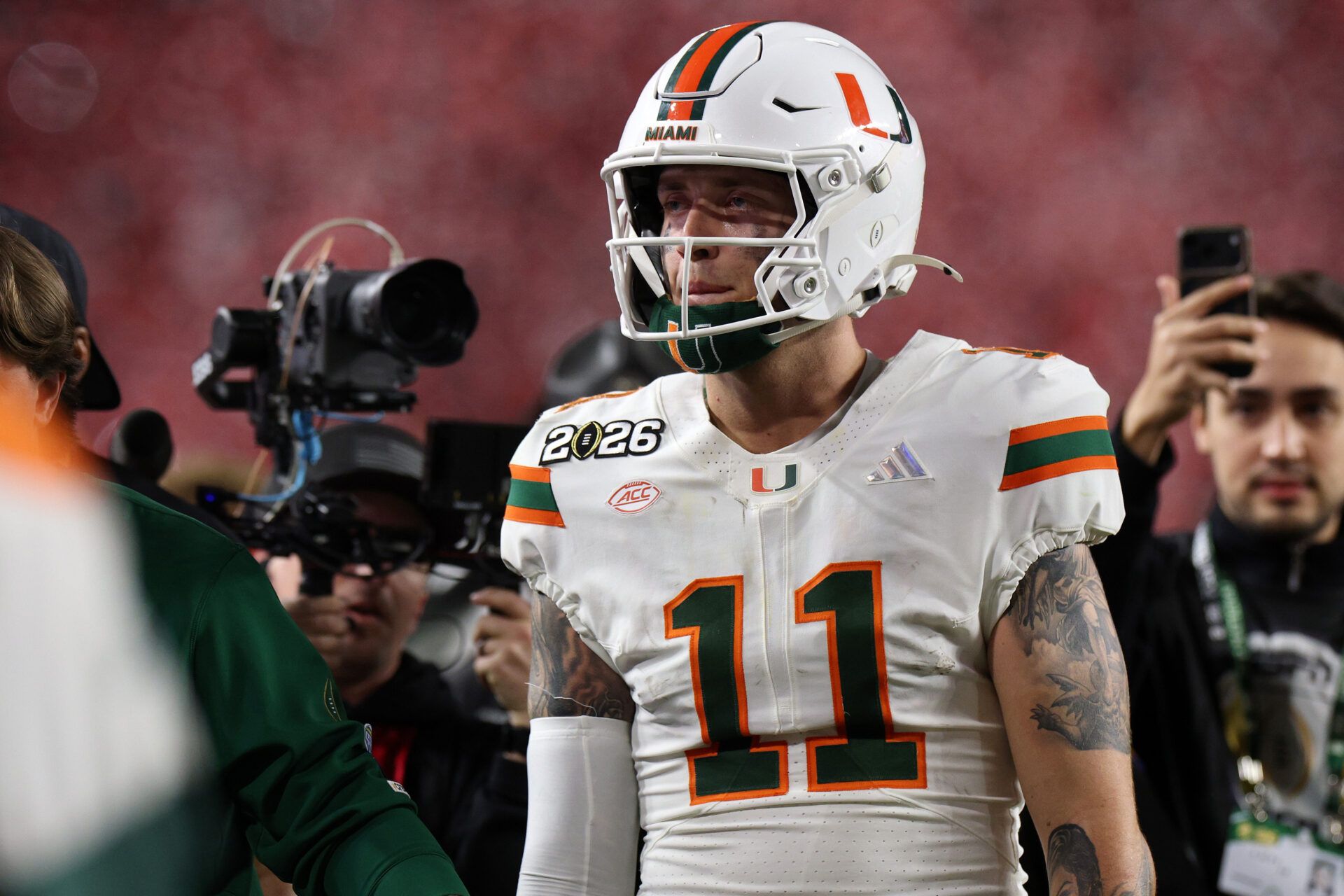 Miami Hurricanes quarterback Carson Beck (11) reacts after the College Football Playoff National Championship game at Hard Rock Stadium.