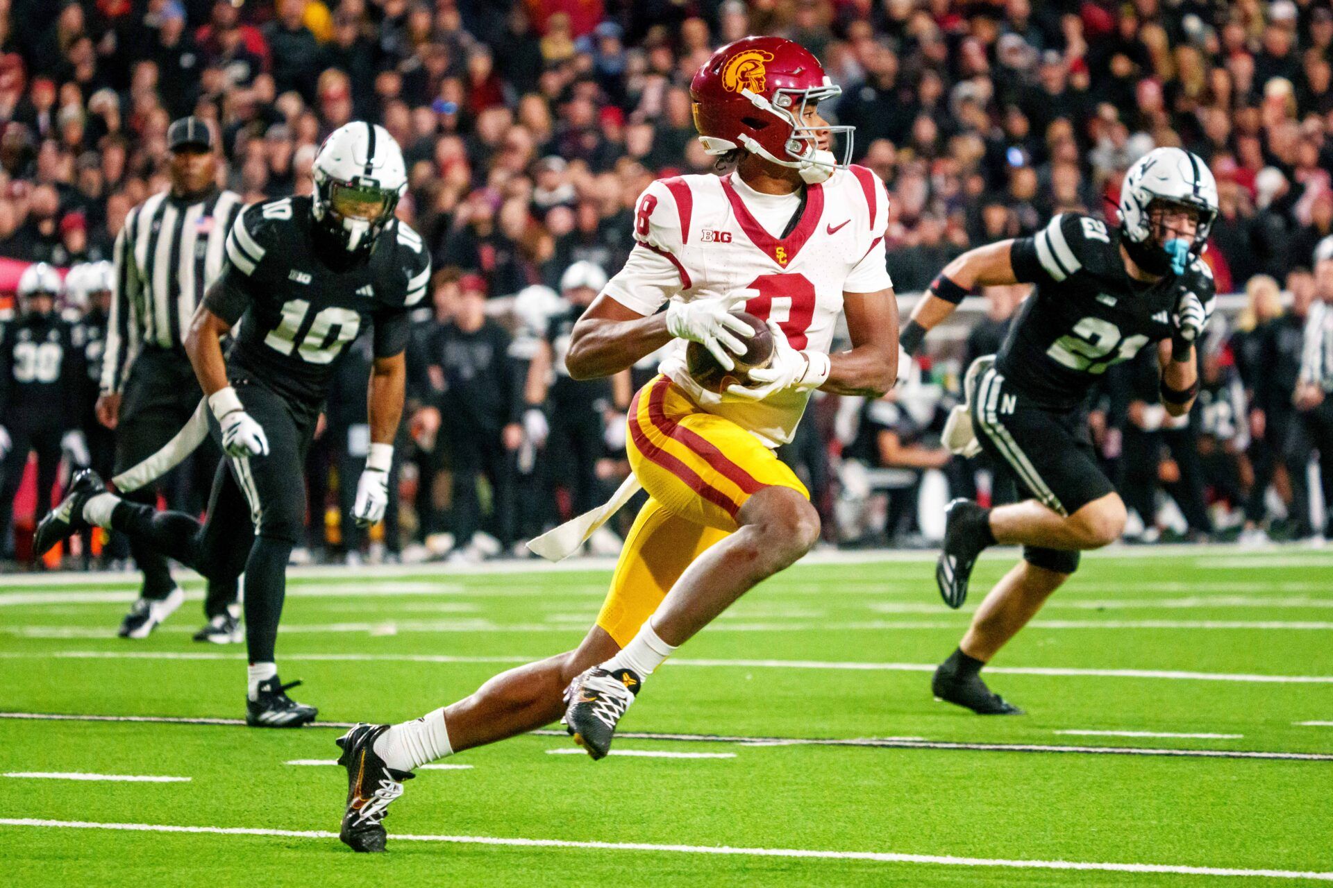 Southern California Trojans wide receiver Ja'Kobi Lane (8) runs against Nebraska Cornhuskers defensive back Andrew Marshall (10) and defensive back Rex Guthrie (21) during the second quarter at Memorial Stadium.
