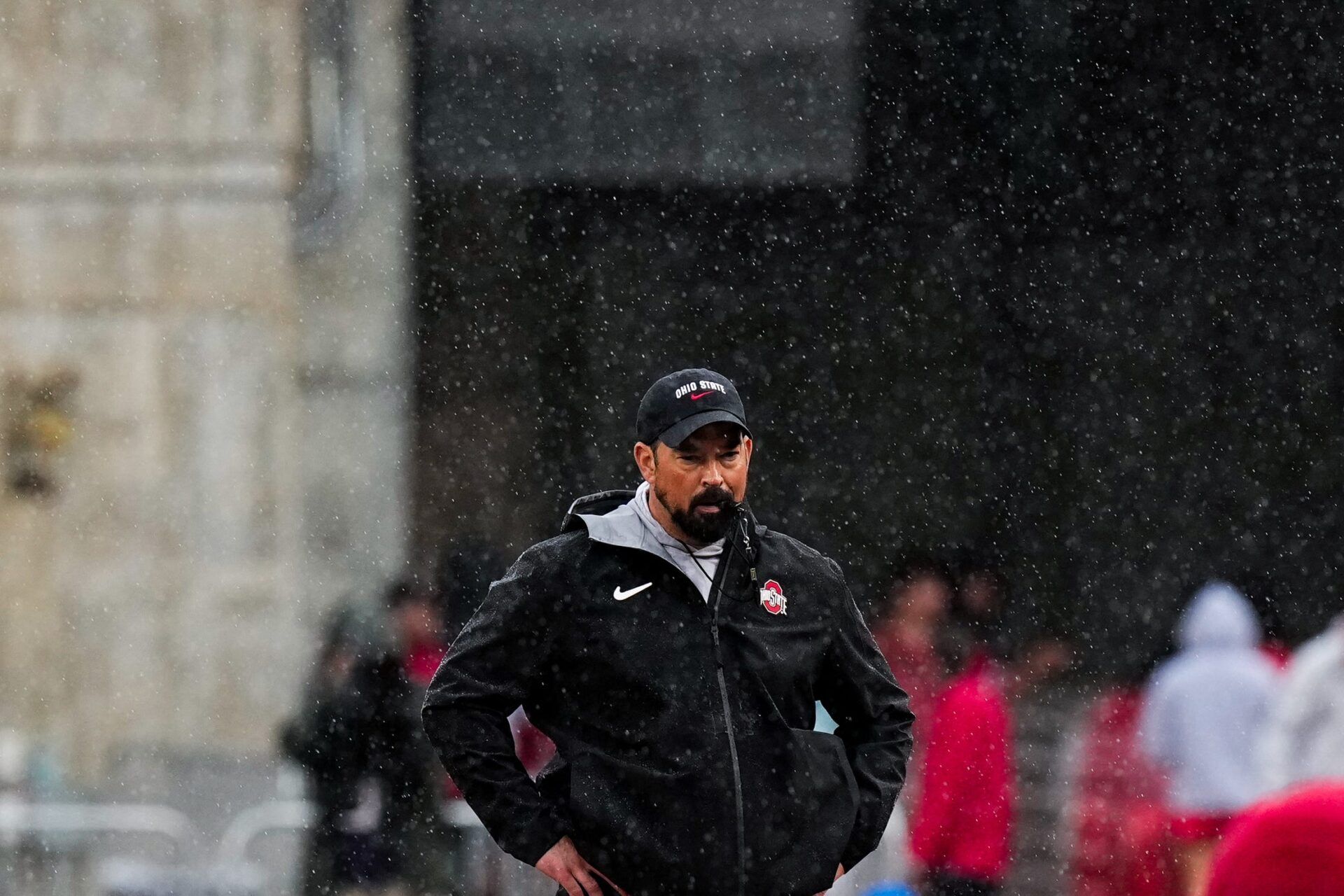 Ohio State Buckeyes head coach Ryan Day watches his players in the rain during the Ohio State football spring game at Ohio Stadium on Saturday, April 18, 2026 in Columbus, Ohio.