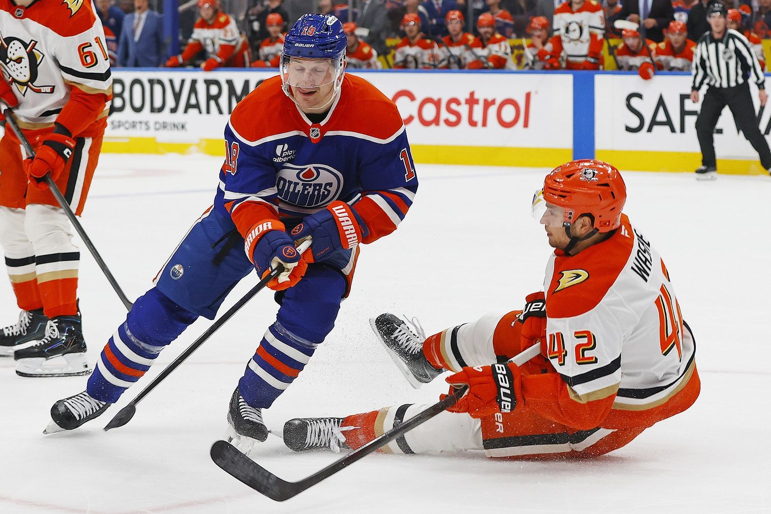 Edmonton Oilers forward Zach Hyman (18) checks Anaheim Ducks forward Tim Washe (42) during the first period in game two of the first round of the 2026 Stanley Cup Playoffs at Rogers Place.
