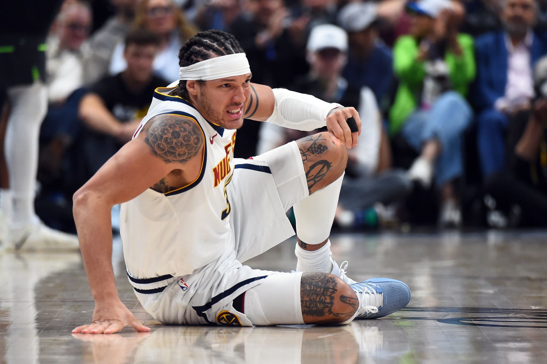 Denver Nuggets forward Aaron Gordon (32) on the floor after a play during the second half against the Minnesota Timberwolves in game one of the first round of the 2026 NBA Playoffs at Ball Arena.