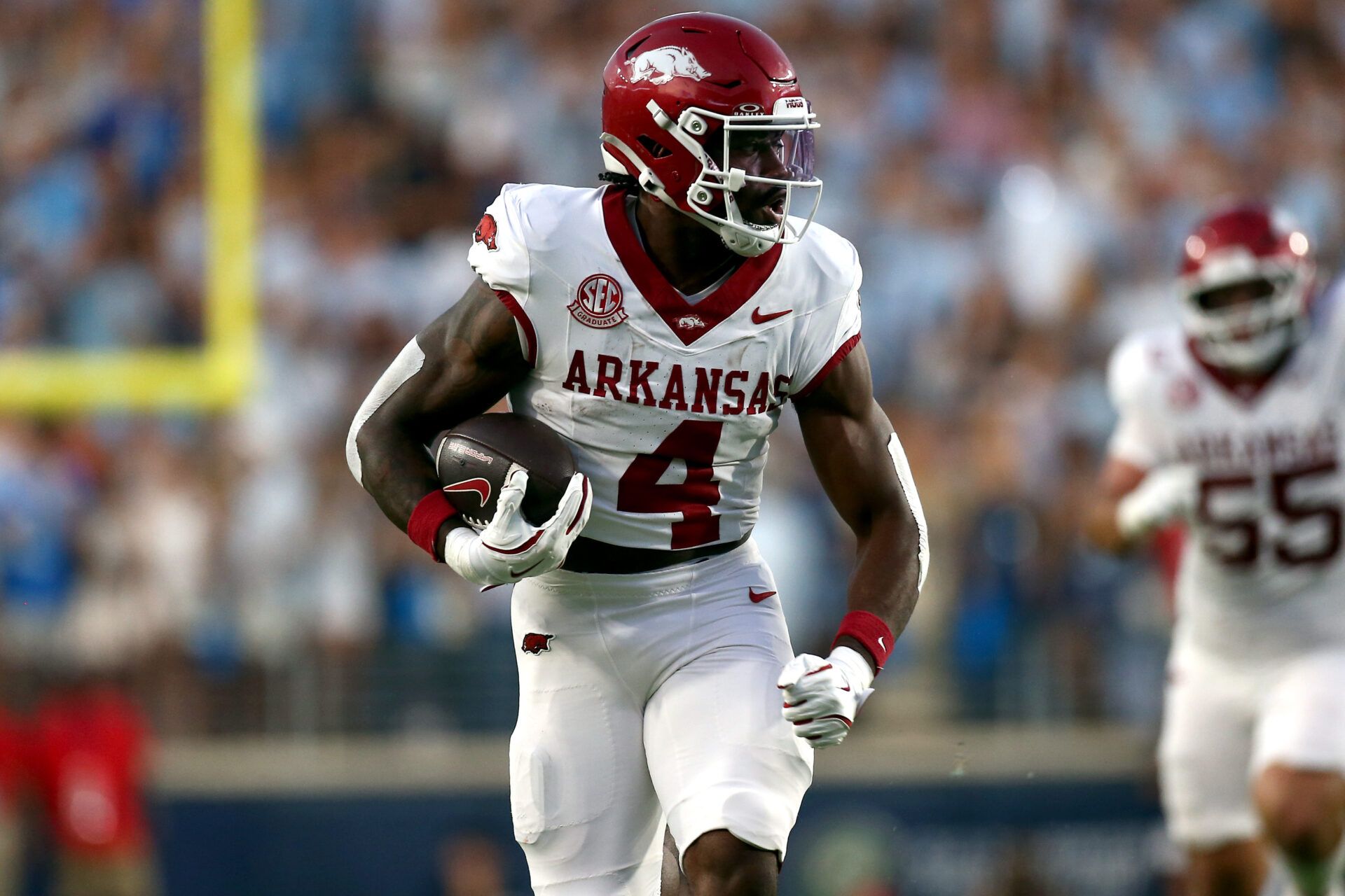 Arkansas Razorback running back Mike Washington Jr. (4) runs the ball for a touchdown during the second quarter against the Mississippi Rebels at Vaught-Hemingway Stadium.
