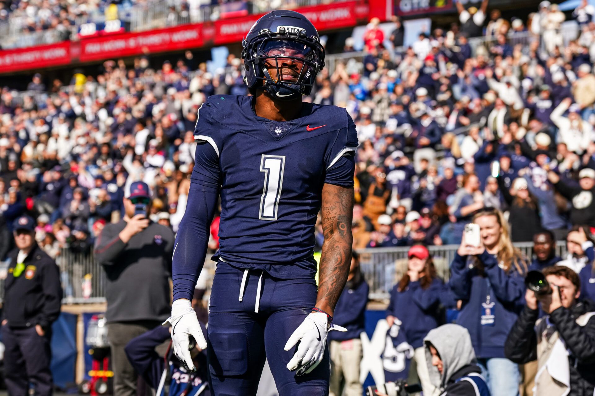 UConn Huskies wide receiver Skyler Bell (1) reacts after his touchdown against the UAB Blazers in the second quarter at Pratt & Whitney Stadium at Rentschler Field.