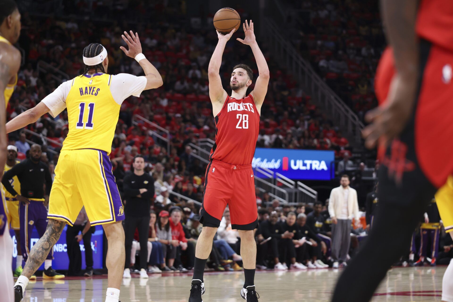 Houston Rockets center Alperen Sengun (28) shoots the ball as Los Angeles Lakers center/forward Jaxson Hayes (11) defends during the first quarter during game three of the first round of the 2026 NBA Playoffs at Toyota Center.
