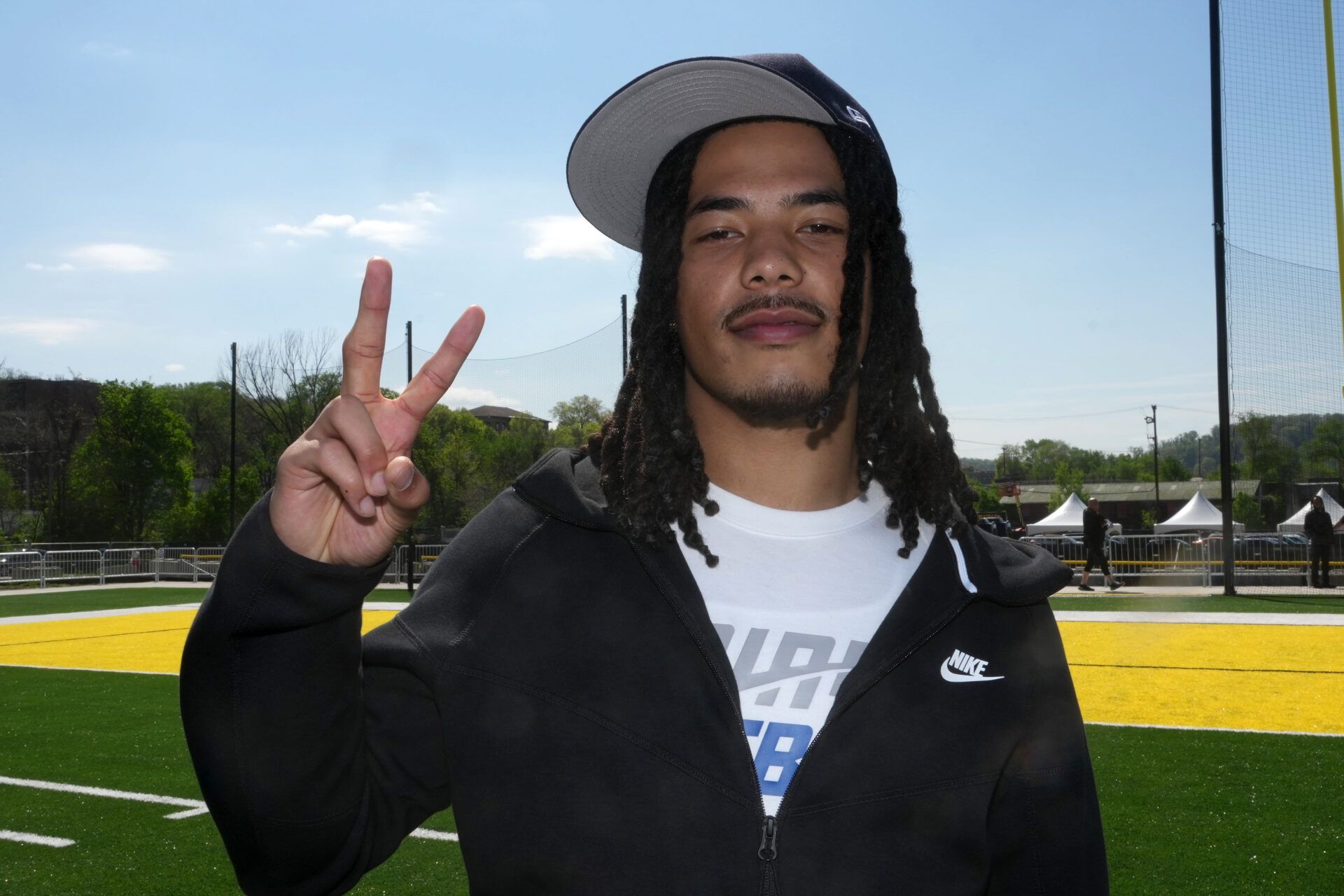 Southern California Trojans receiver Makai Lemon poses with Fight On sign during the NFL Draft prospects clinic at Hazelwood Green Park.