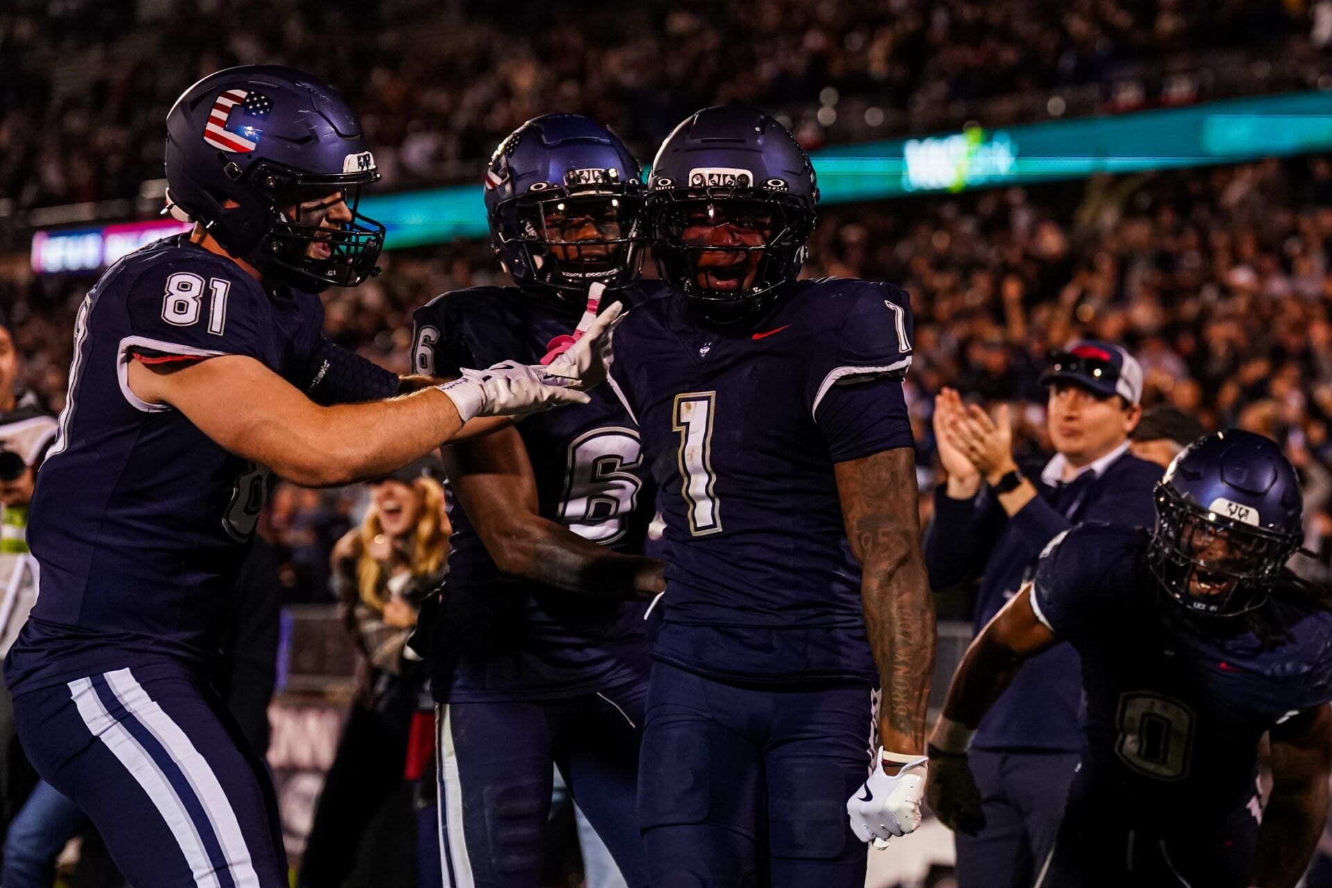 UConn Huskies wide receiver Skyler Bell (1) is congratulated after his touchdown against the Duke Blue Devils in the second half at Pratt & Whitney Stadium at Rentschler Field.
