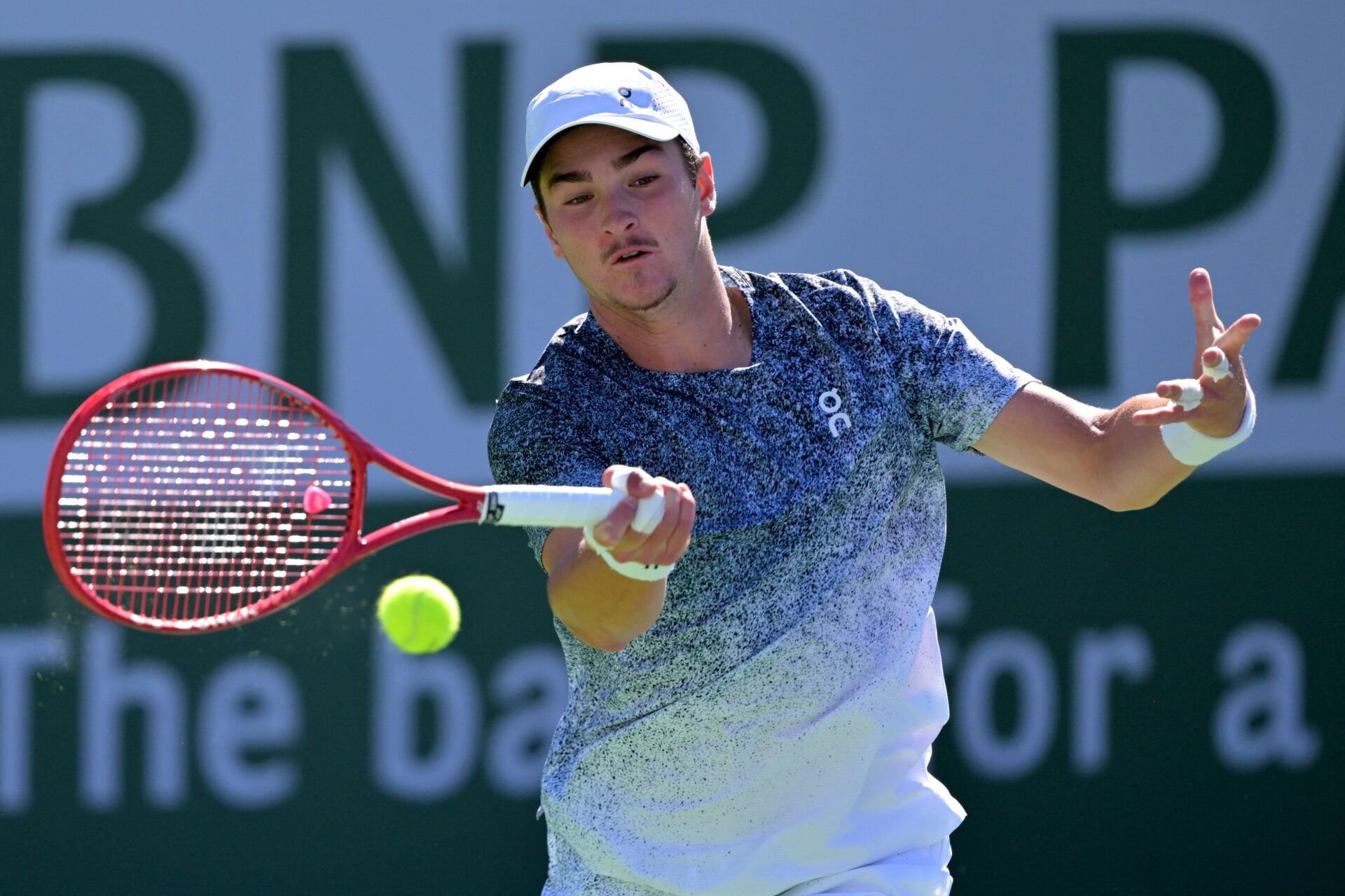 Joao Fonseca (BRA) hits a shot during his second round match against Karen Khachanov (RUS) in the BNP Paribas Open at the Indian Wells Tennis Garden.