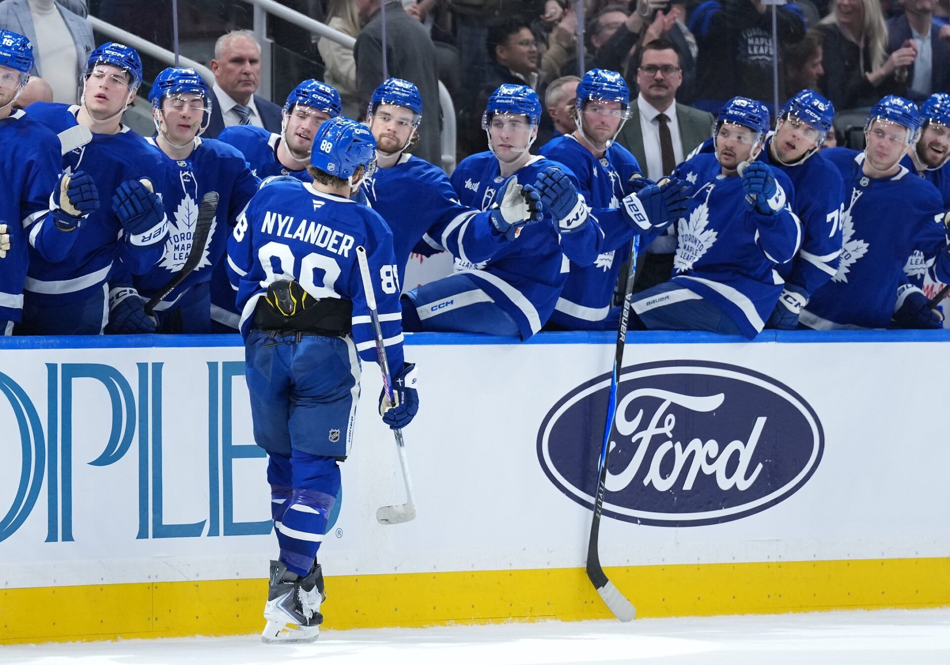 Toronto Maple Leafs right wing William Nylander (88) celebrates at the bench after scoring a goal against the Dallas Stars during the first period at Scotiabank Arena.