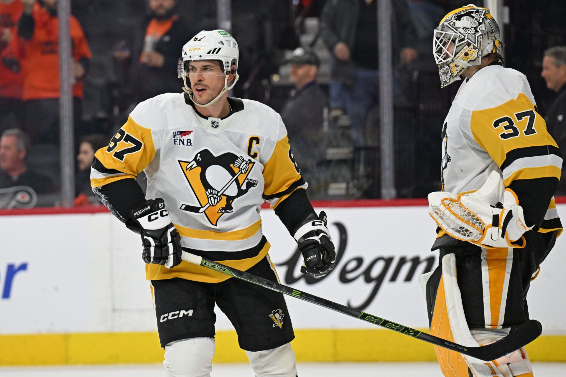 Pittsburgh Penguins center Sidney Crosby (87) and goaltender Arturs Silovs (37) celebrate win against the Philadelphia Flyers during the third period in game four of the first round of the 2026 Stanley Cup Playoffs at Xfinity Mobile Arena.