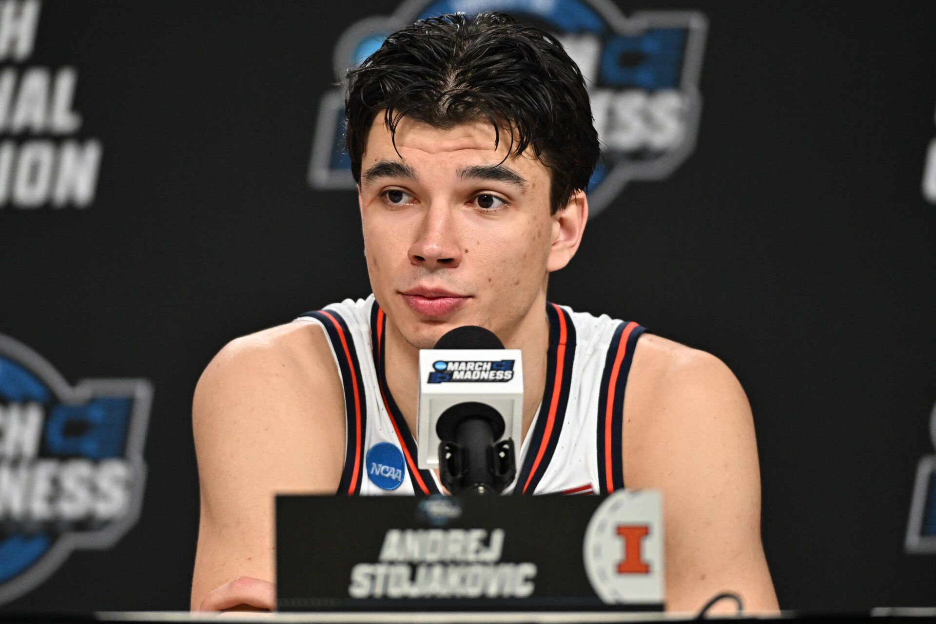 Illinois Fighting Illini guard Andrej Stojakovic (2) speaks in a press conference after defeating the Iowa Hawkeyes in an Elite Eight game of the South Regional of the men's 2026 NCAA Tournament at Toyota Center.
