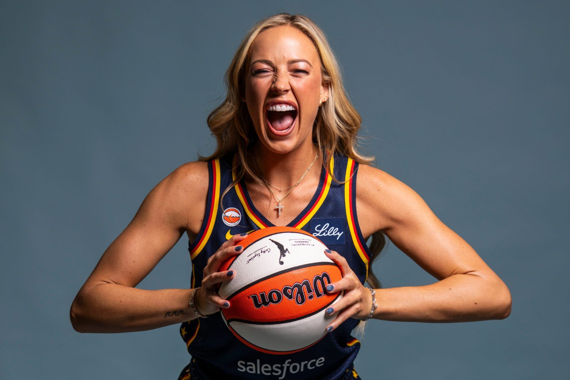 Indiana Fever guard Sophie Cunningham (8) poses for a photo Wednesday, April 22, 2026, during media day at Gainbridge Fieldhouse in Indianapolis.