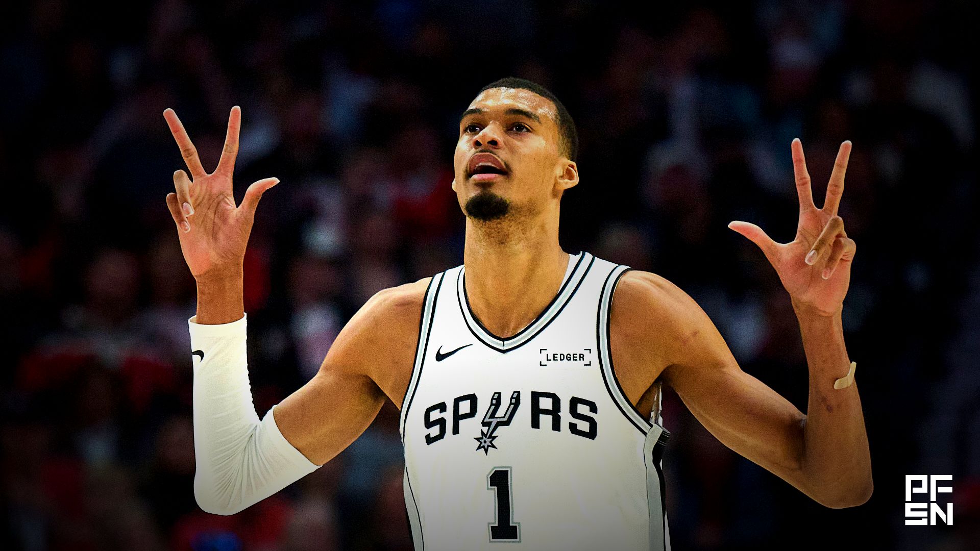 San Antonio Spurs forward Victor Wembanyama (1) celebrates a three point basket by guard De'aaron Fox (4) during the first half of game four of the first round of the 2026 NBA Playoffs against the Portland Trail Blazers at Moda Center.