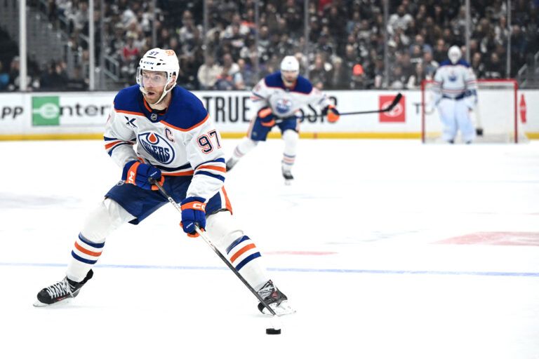 Edmonton Oilers center Connor McDavid (97) skates with the puck at Crypto.com Arena.