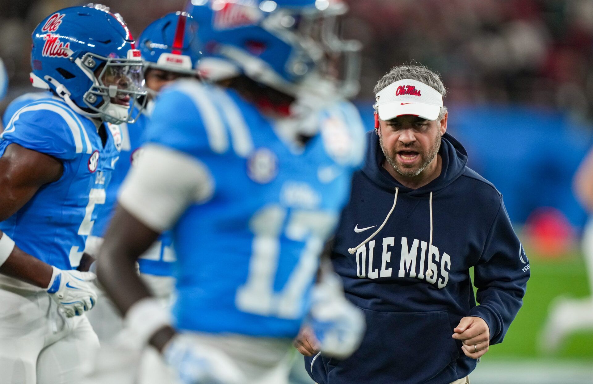 Ole Miss head coach Pete Golding runs off the field during warmups before the CFP Fiesta Bowl at the State Farm Stadium, in Glendale, Ariz., on Thursday, Jan. 8, 2026.