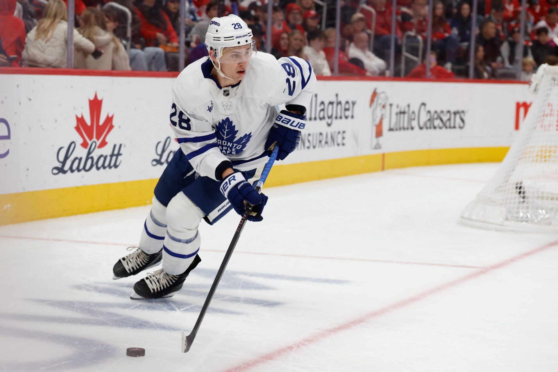 Toronto Maple Leafs defenseman Troy Stecher (28) skates with the puck in the second period against the Detroit Red Wings at Little Caesars Arena.