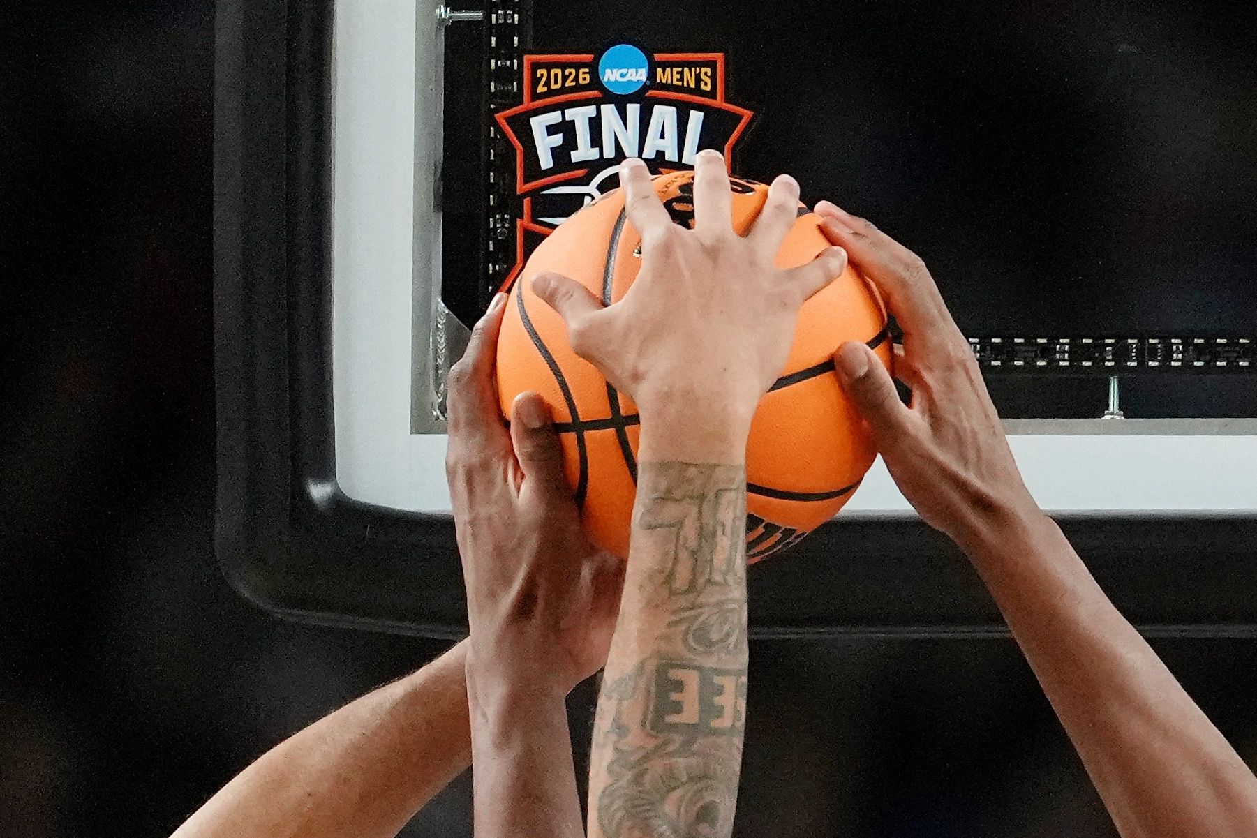 Michigan Wolverines guard Roddy Gayle Jr. (11) reaches for the ball against UConn Huskies forward Tarris Reed Jr. (5) during the second half in the national championship of the Final Four of the men's 2026 NCAA Tournament between the  and the Michigan Wolverines at Lucas Oil Stadium.