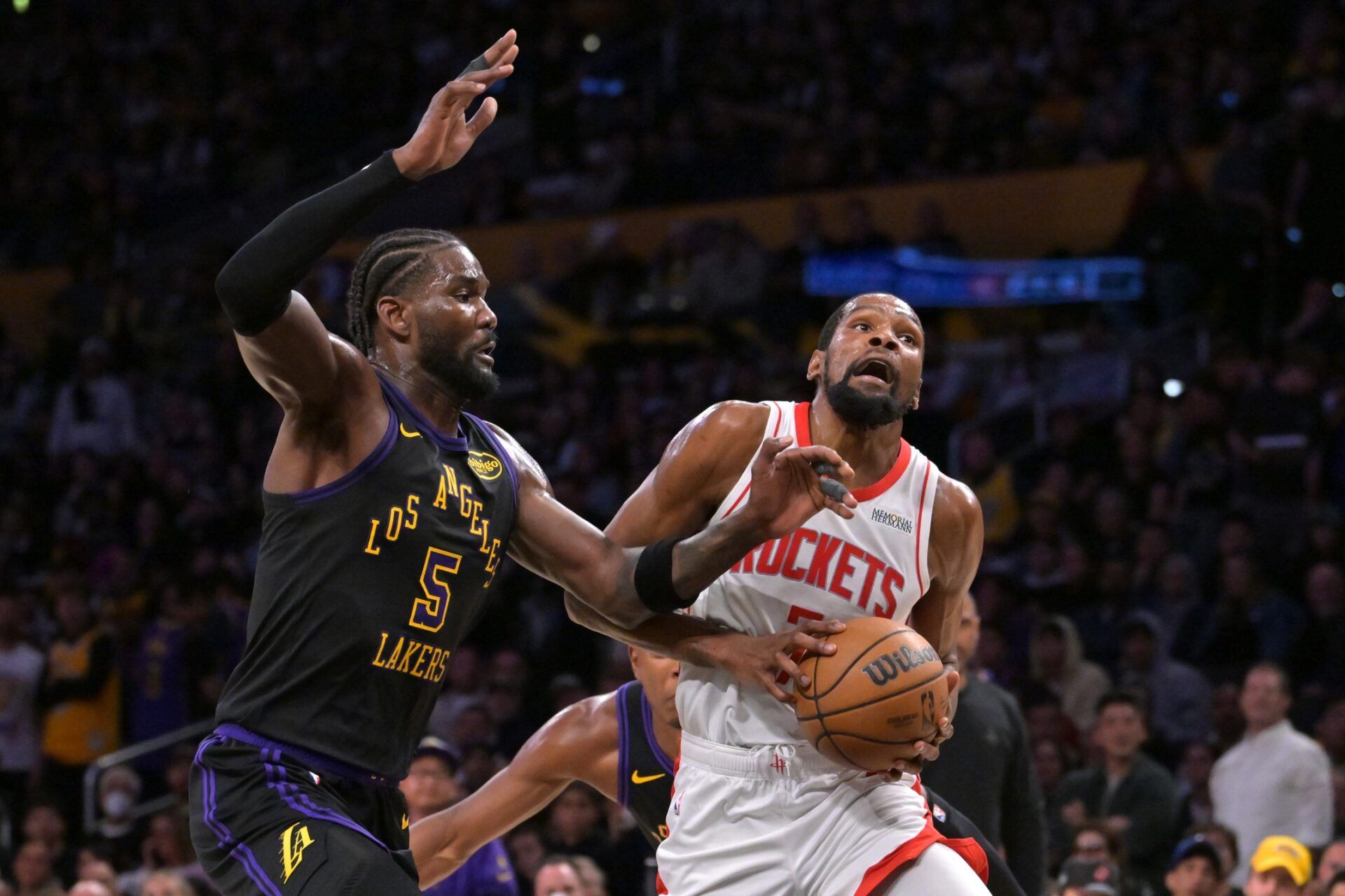 Houston Rockets forward Kevin Durant (7) is defended by Los Angeles Lakers center Deandre Ayton (5) as he drives to the basket during the second half of game two of the first round of the 2026 NBA Playoffs at Crypto.com Arena.