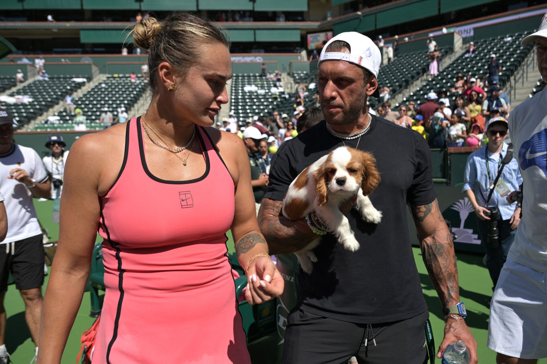 Aryna Sabalenka (BEL) with her fiance Georgios Frangulisafter and Cavalier King Charles puppy Ash after winning the womenÕs final of the BNP Paribas Open defeating Elena Rybakina (KAZ) at the Indian Wells Tennis Garden.